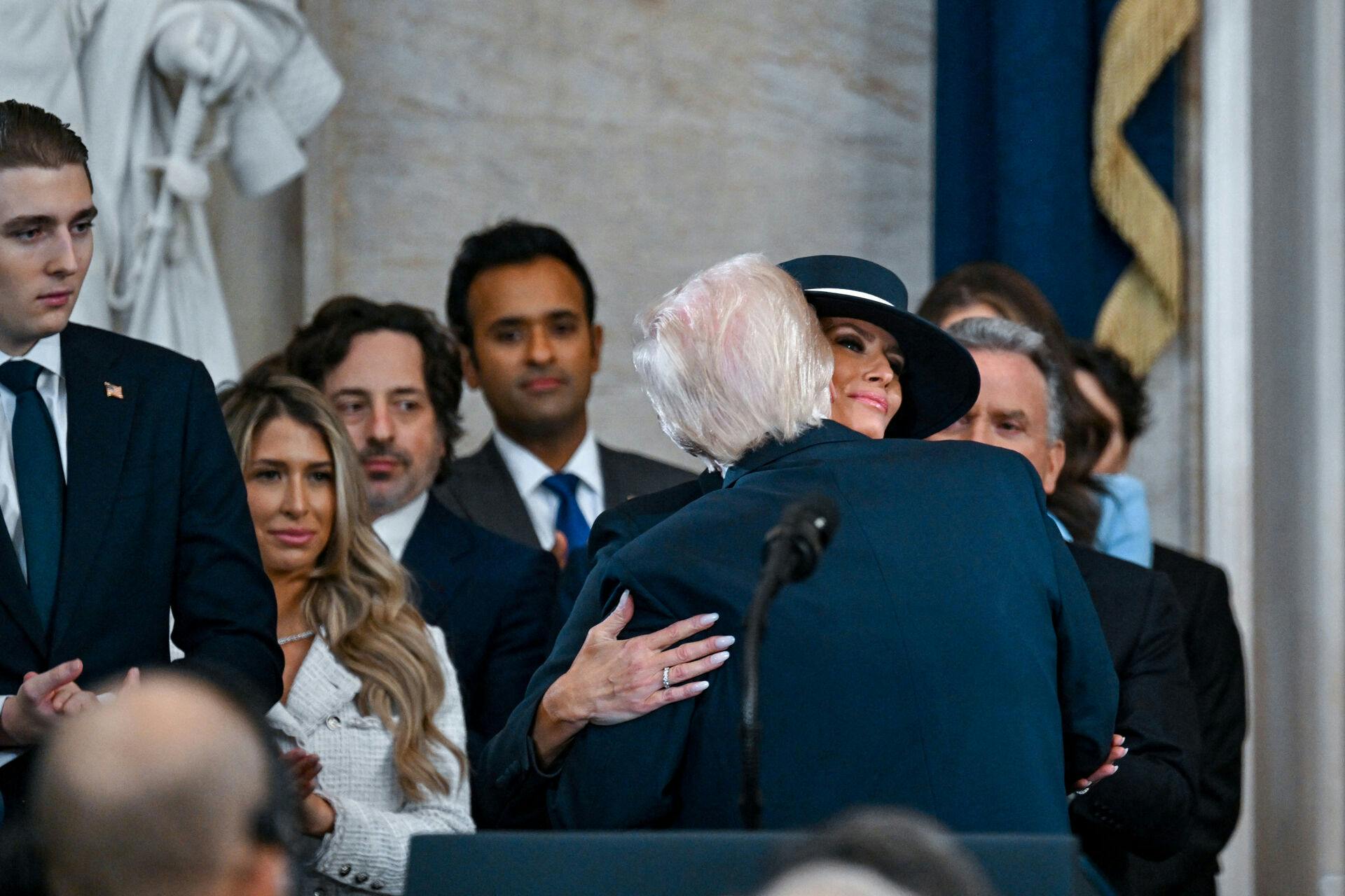 President Donald Trump embraces Melania Trump after the inauguration of Donald Trump as the 47th president of the United States takes place inside the Capitol Rotunda of the U.S. Capitol building in Washington, D.C., Monday, January 20, 2025. It is the 60th U.S. presidential inauguration and the second non-consecutive inauguration of Trump as U.S. president. Kenny Holston/Pool via REUTERS