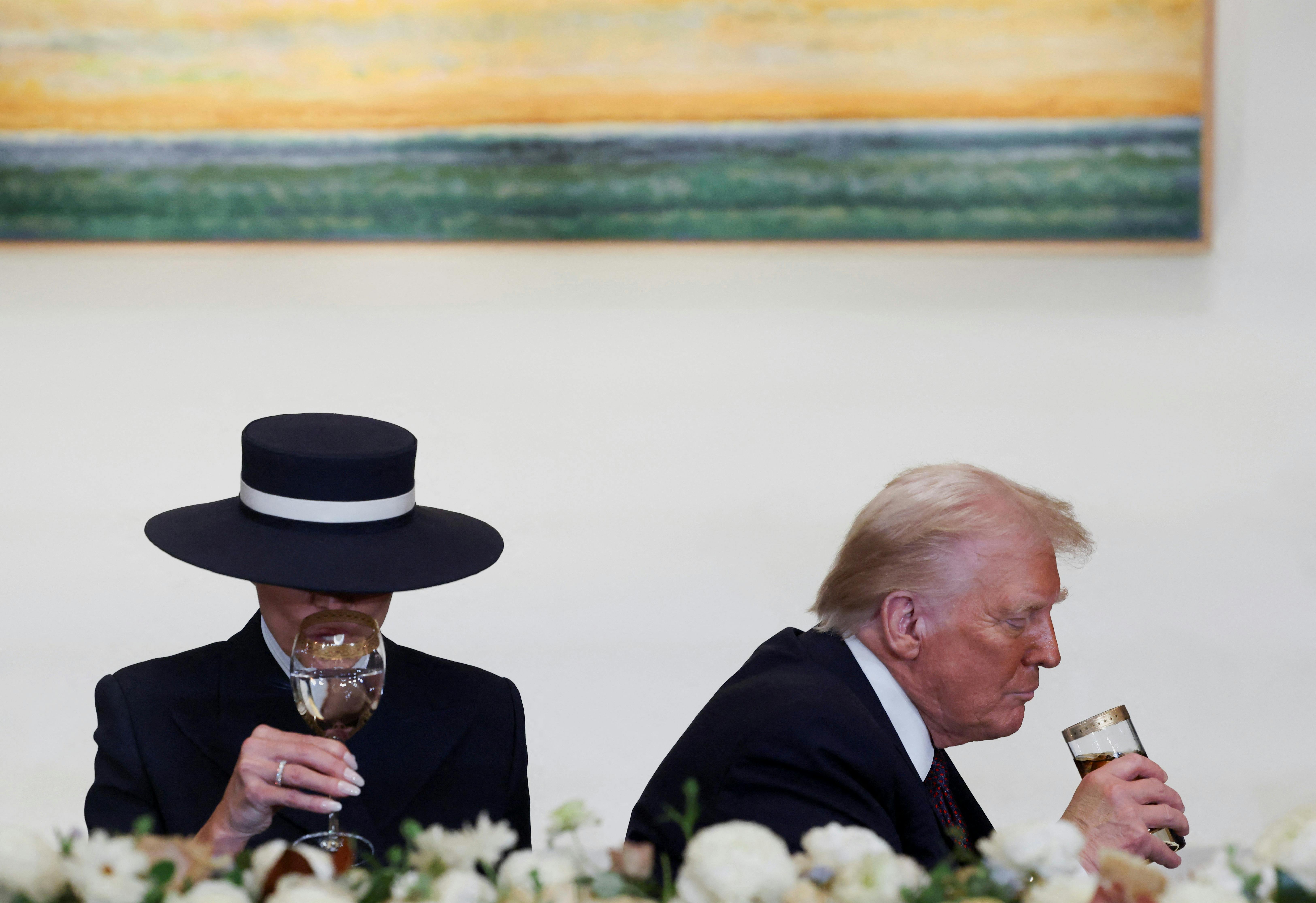 U.S. President Donald Trump and U.S. first lady Melania Trump attend the luncheon in the Statuary Hall of the U.S. Capitol on the inauguration day of Trump's second Presidential term in Washington, U.S., January 20, 2025. REUTERS/Evelyn Hockstein TPX IMAGES OF THE DAY