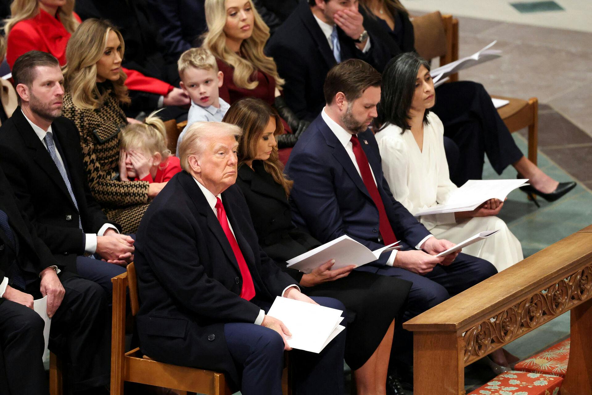 U.S. President Donald Trump, first lady Melania and U.S. Vice President J.D. Vance with second lady Usha, Eric and Lara Trump and their children Carolina and Luke, and Tiffany Trump attend the National Day of Prayer Service at the Washington National Cathedral in Washington, U.S., January 21, 2025. REUTERS/Kevin Lamarque