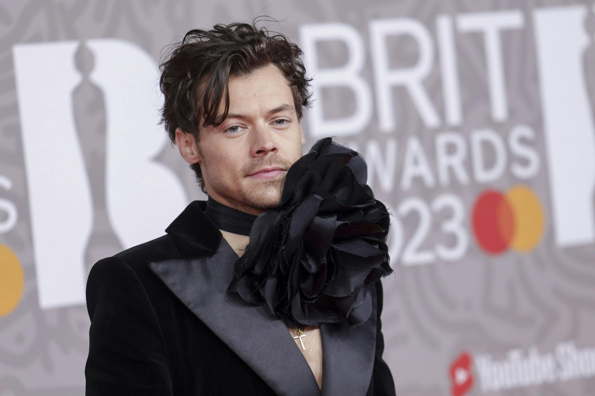 Harry Styles poses for photographers upon arrival at the Brit Awards 2023 in London, Saturday, Feb. 11, 2023. (Photo by Vianney Le Caer/Invision/AP)