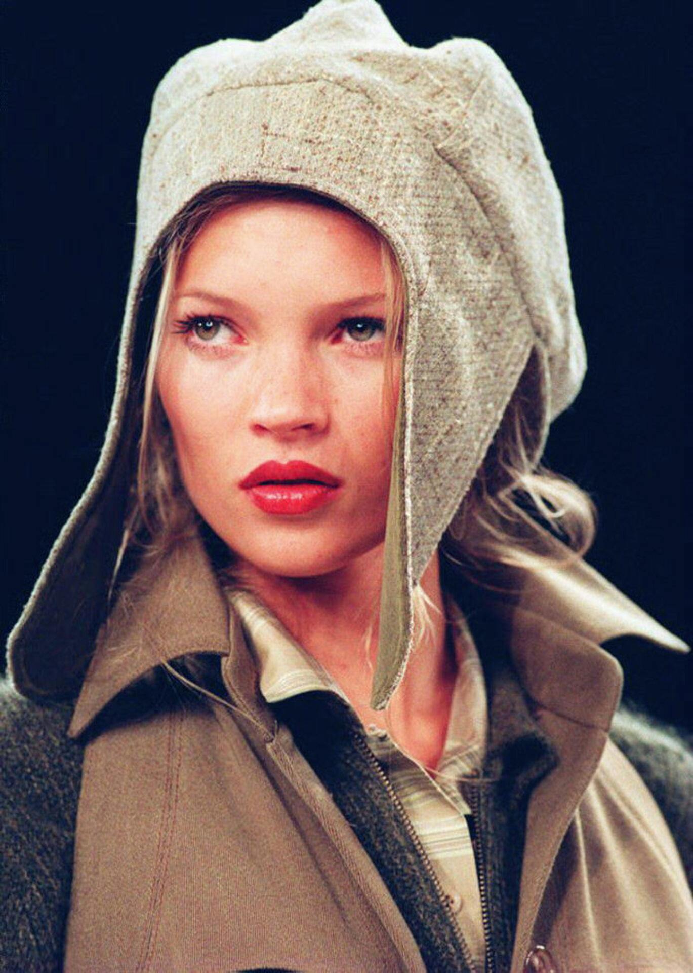 Model Kate Moss wears a flapped hat with a suede jacket, 07 April 1994, during the showing of the Fall 1994 Anne Klein collection.