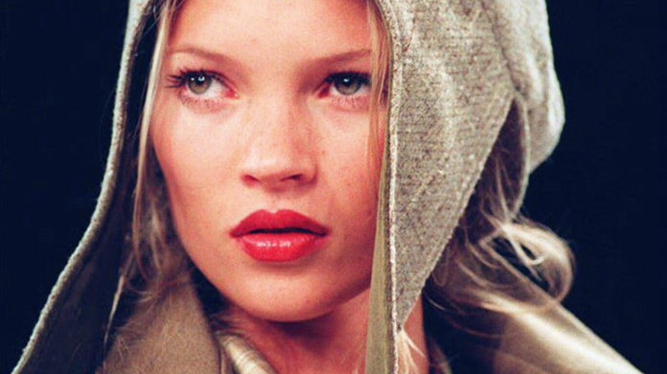 Model Kate Moss wears a flapped hat with a suede jacket, 07 April 1994, during the showing of the Fall 1994 Anne Klein collection.