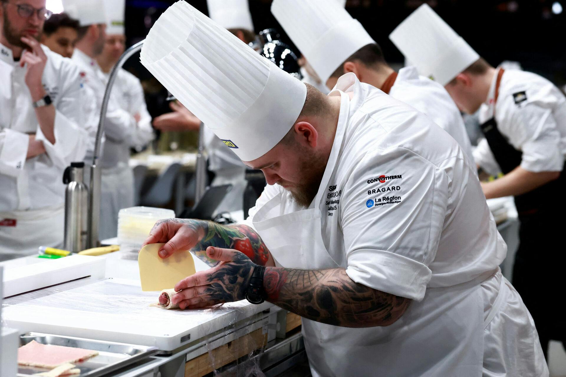 Chef Sebastian Holberg Svendsgaard of Denmark prepares a dish as he competes during the Grand Final of the Bocuse d'Or gastronomic competition in Chassieu near Lyon, France, January 27, 2025. REUTERS/Manon Cruz