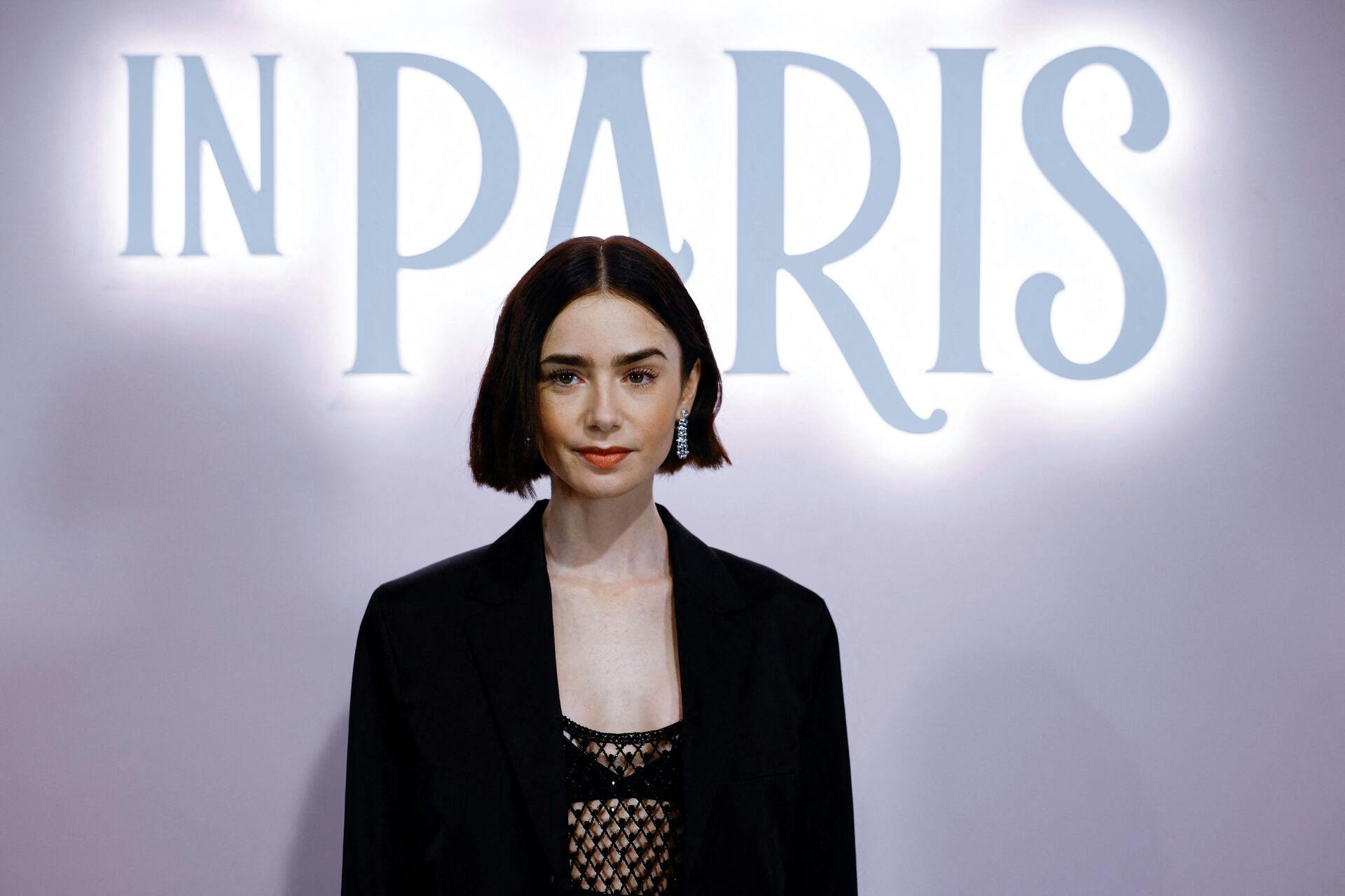 Lily Collins poses during a photocall for the launch of the Season 4 of Netflix Series "Emily in Paris", at the Samaritaine department store in Paris, France, September 12, 2024. REUTERS/Sarah Meyssonnier