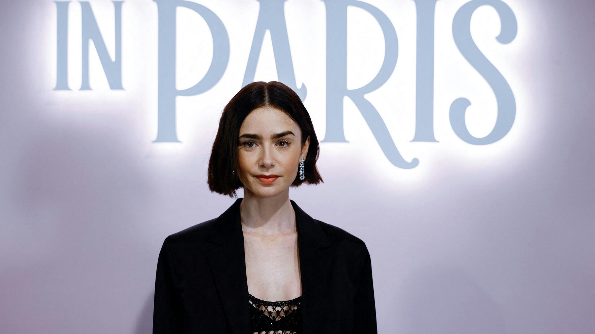 Lily Collins poses during a photocall for the launch of the Season 4 of Netflix Series "Emily in Paris", at the Samaritaine department store in Paris, France, September 12, 2024. REUTERS/Sarah Meyssonnier