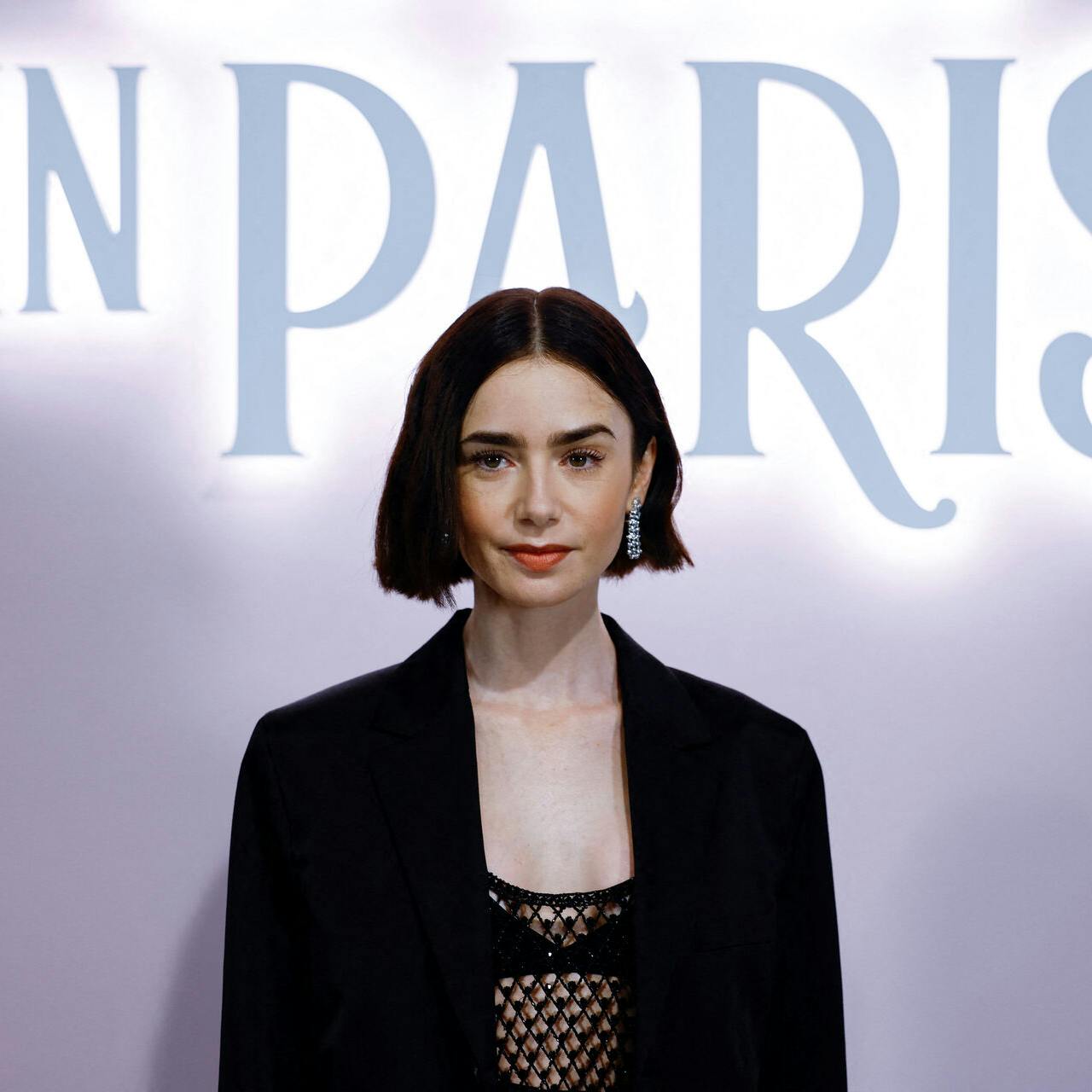 Lily Collins poses during a photocall for the launch of the Season 4 of Netflix Series "Emily in Paris", at the Samaritaine department store in Paris, France, September 12, 2024. REUTERS/Sarah Meyssonnier