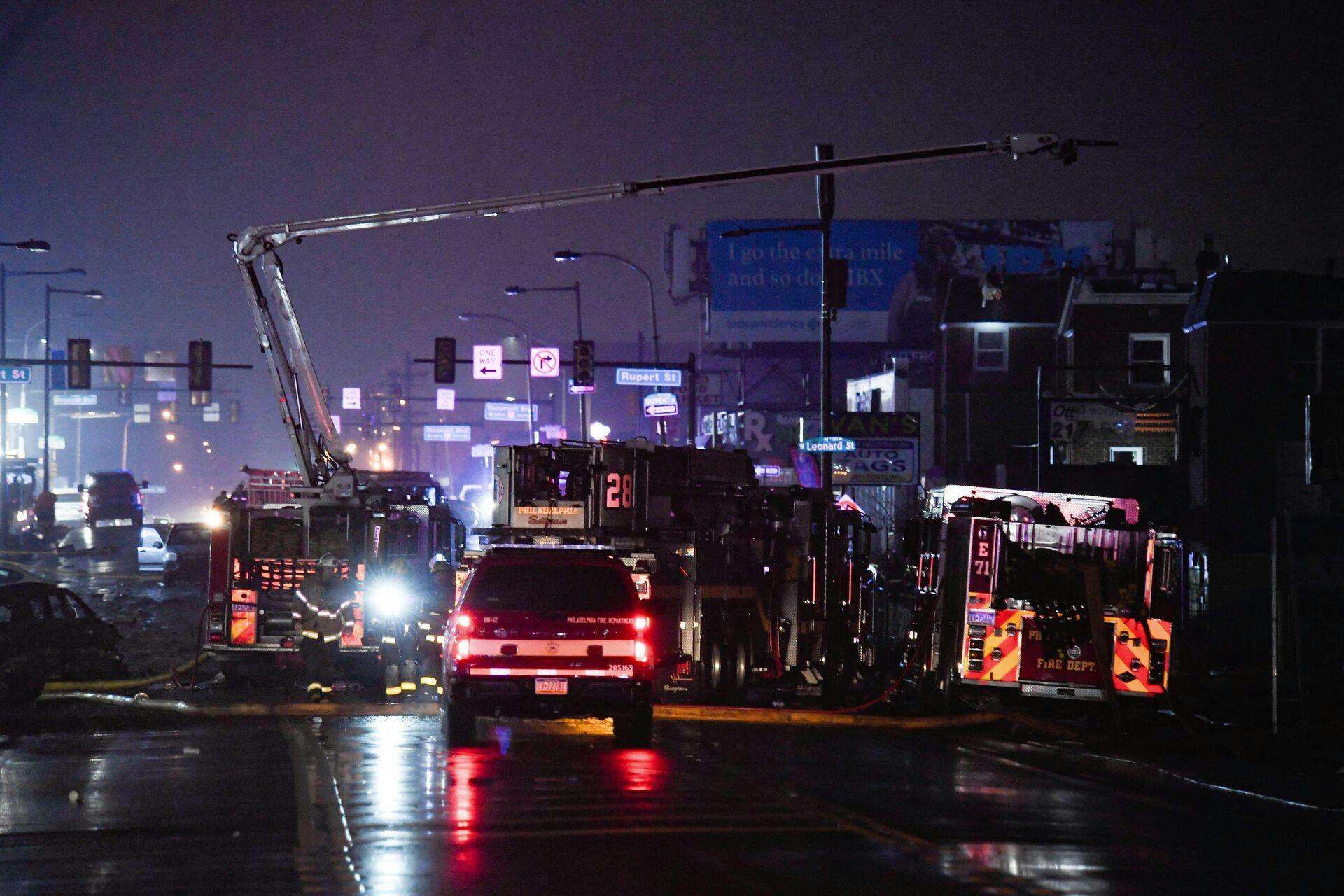 PHILADELPHIA, PENNSYLVANIA - JANUARY 31: Emergency service members respond to a plane crash in a neighborhood near Cottman Avenue on January 31, 2025 in Philadelphia, Pennsylvania. The plane, a medical transport jet carrying a child patient, crashed after taking off from Northeast Philadelphia Airport, damaging several homes and vehicles. Matthew Hatcher/Getty Images/AFP (Photo by Matthew Hatcher / GETTY IMAGES NORTH AMERICA / Getty Images via AFP)