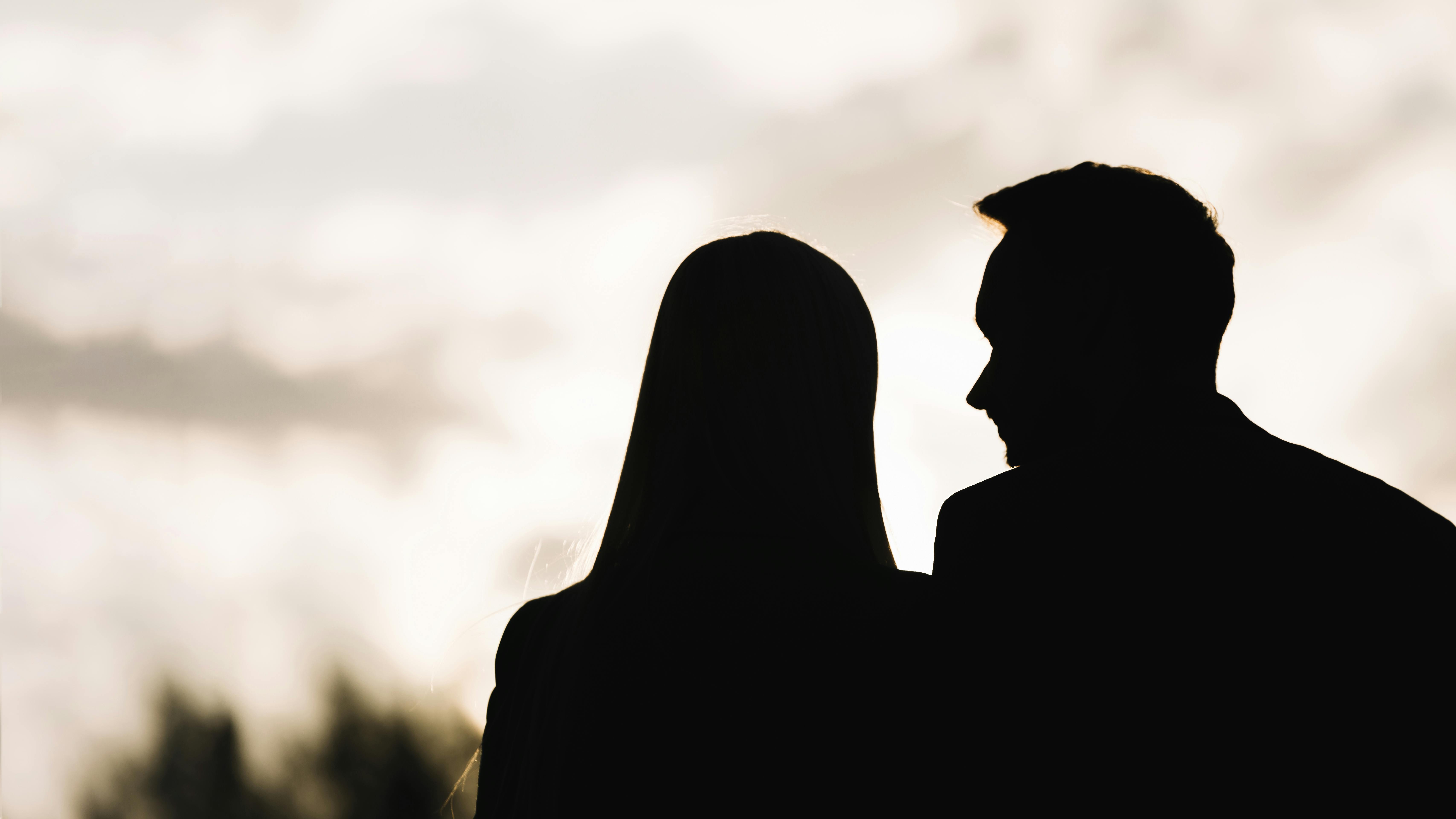 silhouette couple against sky evening