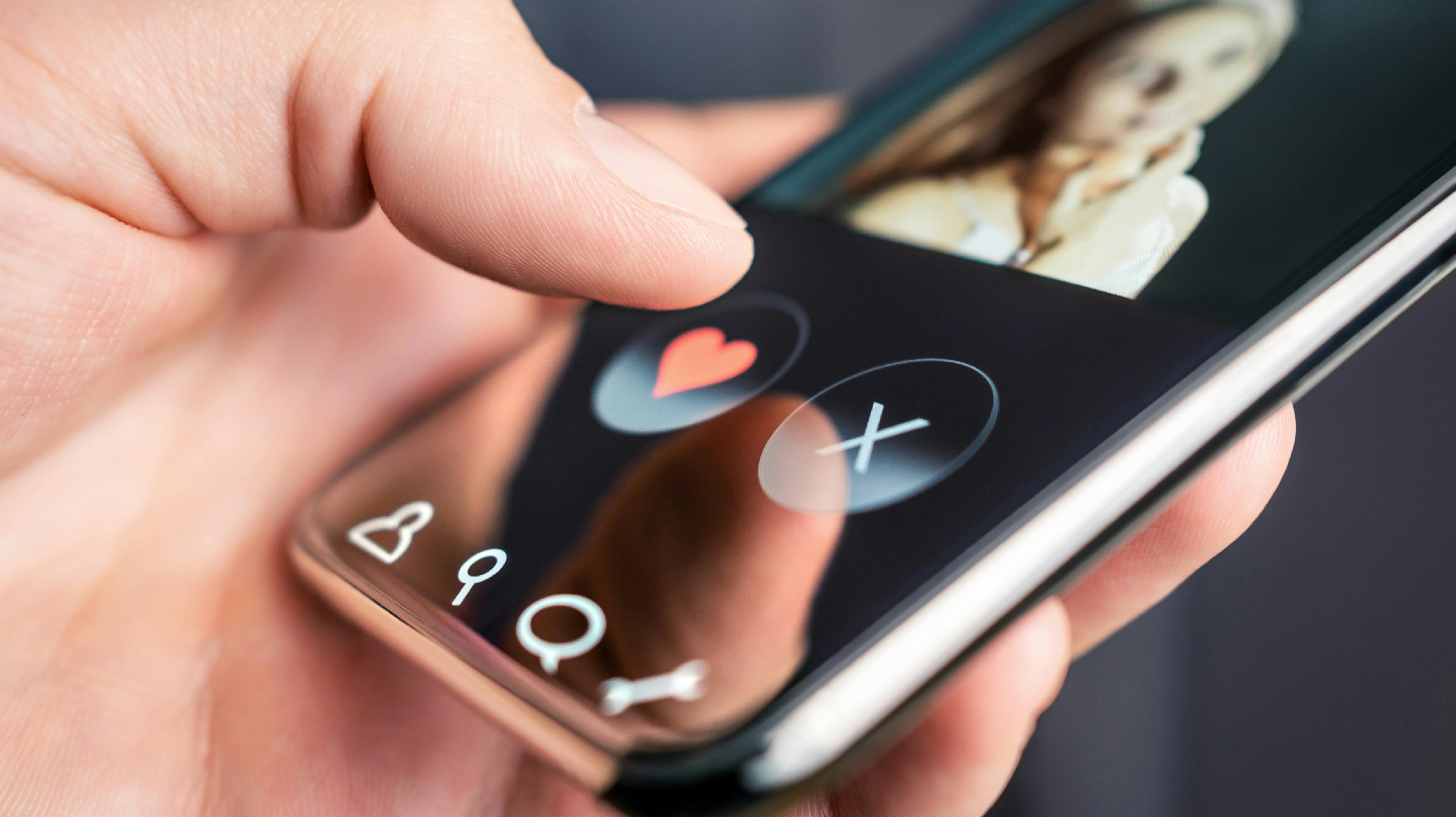 Dating app and online site in mobile phone. Swipe right or left. Beautiful single woman. Man looking for love, romance and relationship on internet with smartphone. Flirting or cheating.