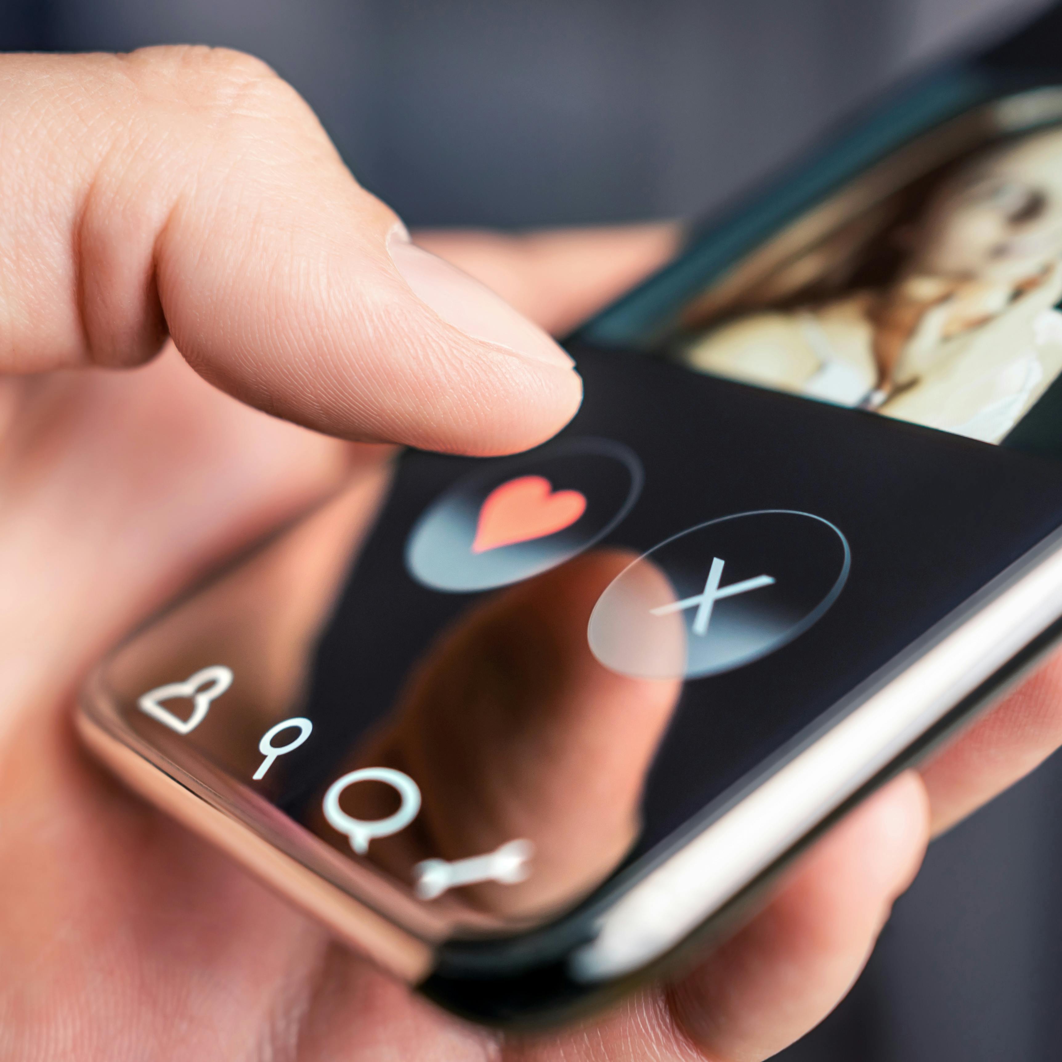 Dating app and online site in mobile phone. Swipe right or left. Beautiful single woman. Man looking for love, romance and relationship on internet with smartphone. Flirting or cheating.