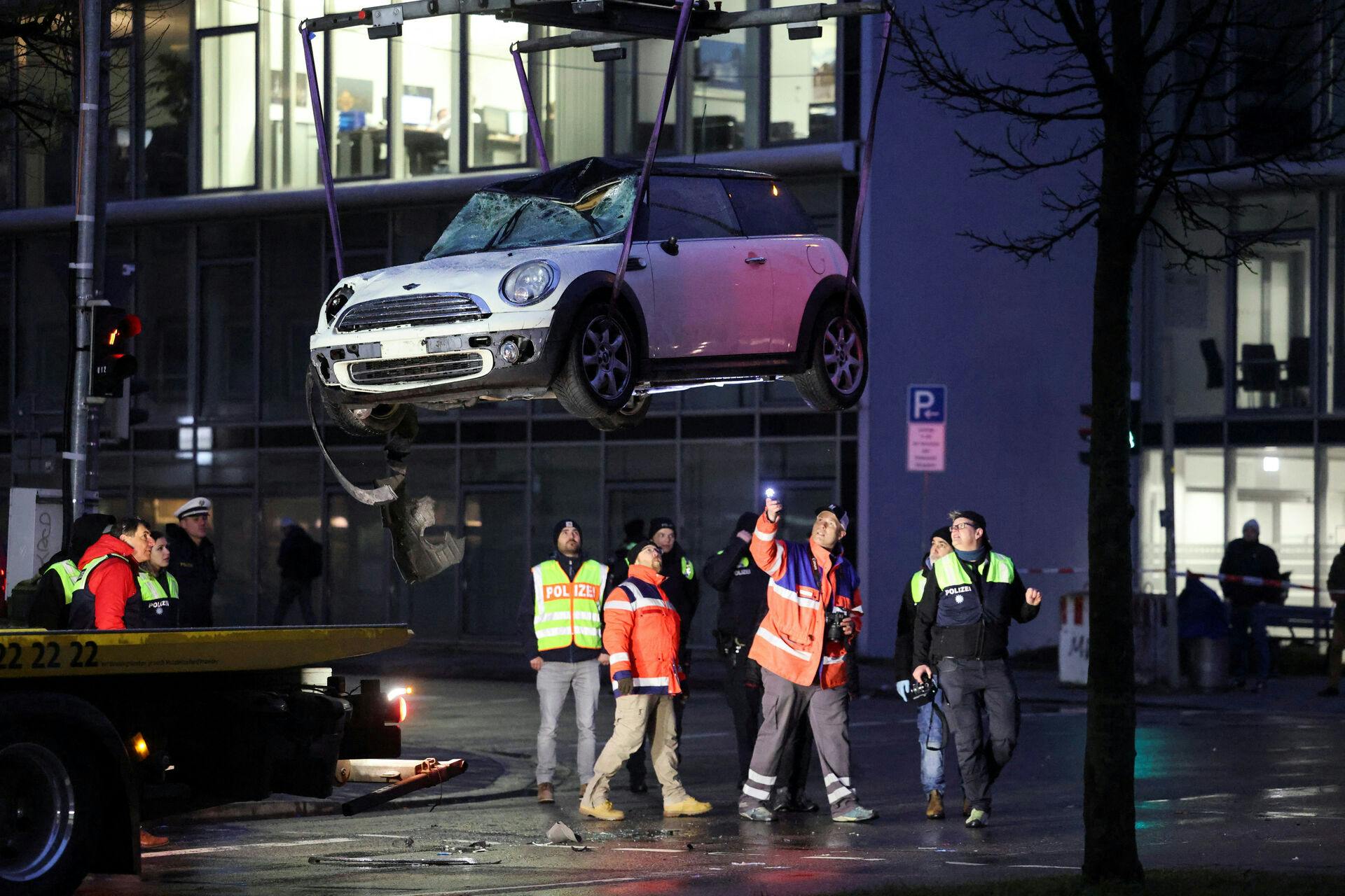 The car used in what the Bavarian Premier Markus Soeder said was probably an attack, is being removed from a street, in Munich, Germany, February 13, 2025. REUTERS/Wolfgang Rattay