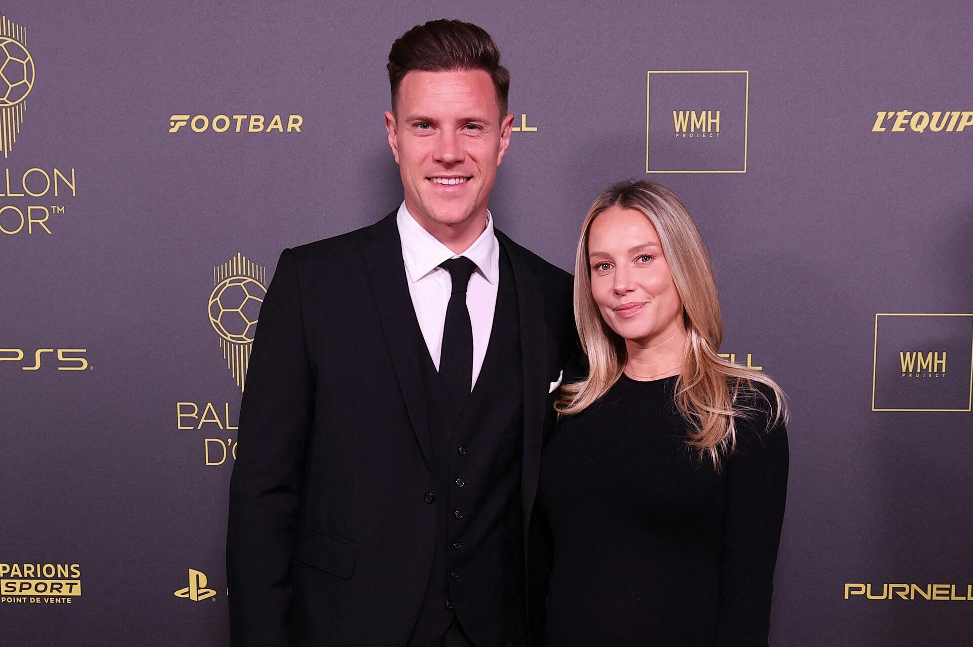 Barcelona's German goalkeeper Marc-Andre ter Stegen (L) poses with his wife Daniela ter Stegen prior to the 2023 Ballon d'Or France Football award ceremony at the Theatre du Chatelet in Paris on October 30, 2023. FRANCK FIFE / AFP