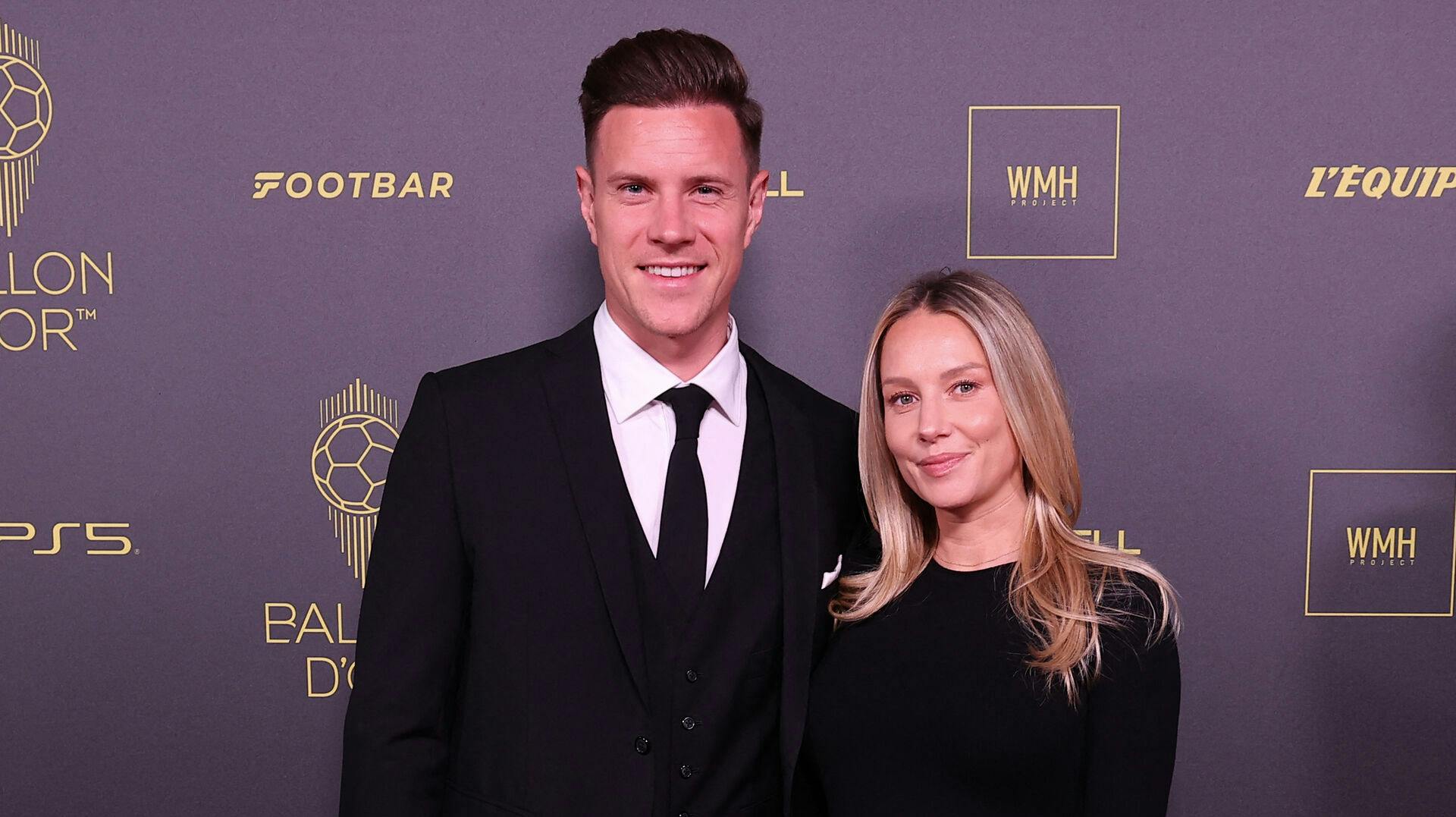 Barcelona's German goalkeeper Marc-Andre ter Stegen (L) poses with his wife Daniela ter Stegen prior to the 2023 Ballon d'Or France Football award ceremony at the Theatre du Chatelet in Paris on October 30, 2023. FRANCK FIFE / AFP