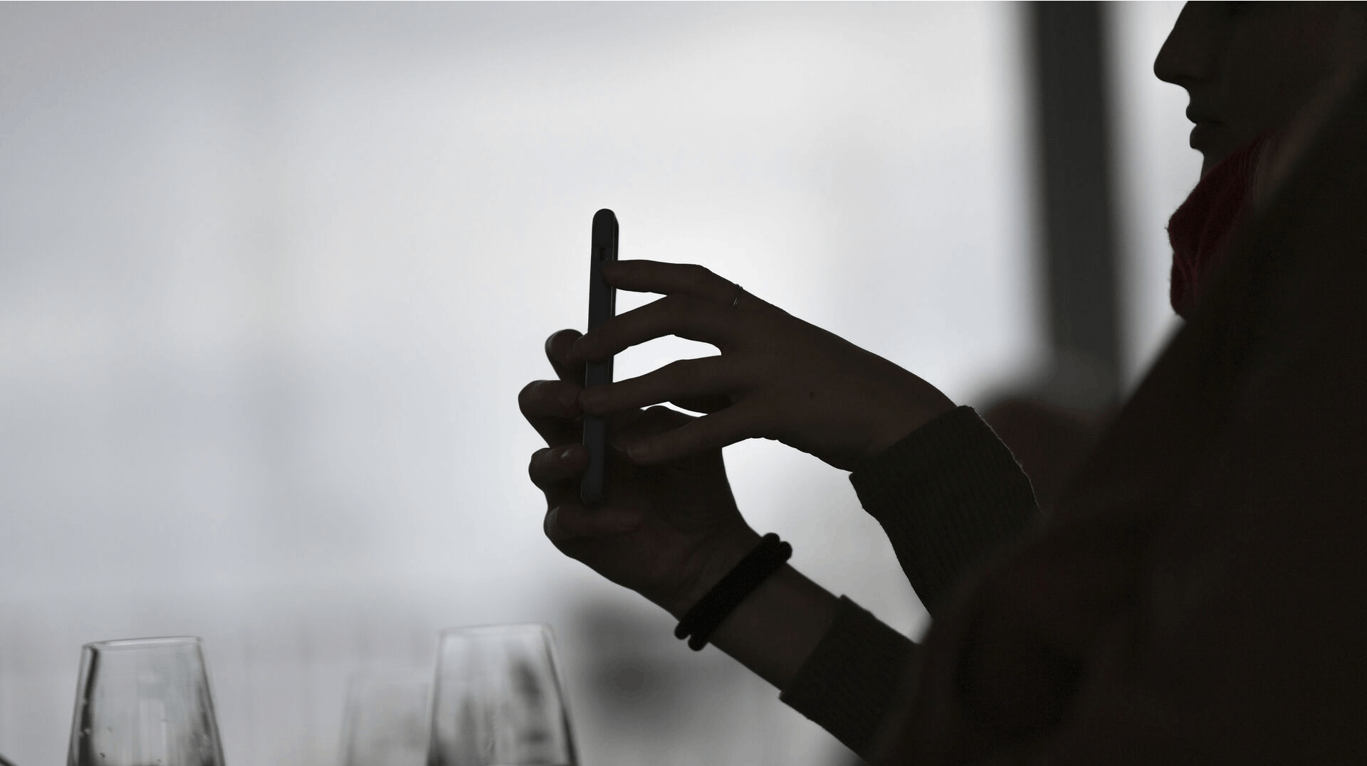 13 March 2019, Berlin: A woman is filming with a smartphone. Photo by: Jens Kalaene/picture-alliance/dpa/AP Images