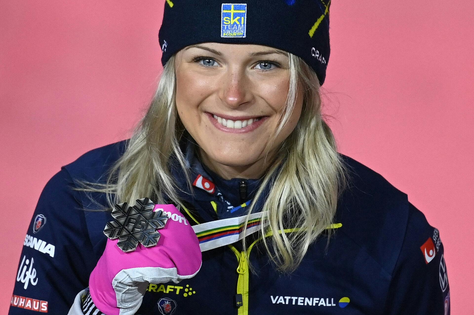 Sweden's Frida Karlsson poses with her silver medal on the podium for the women's 10km race at the FIS Nordic Ski World Championships in Oberstdorf, southern Germany, on March 4, 2021. CHRISTOF STACHE / AFP