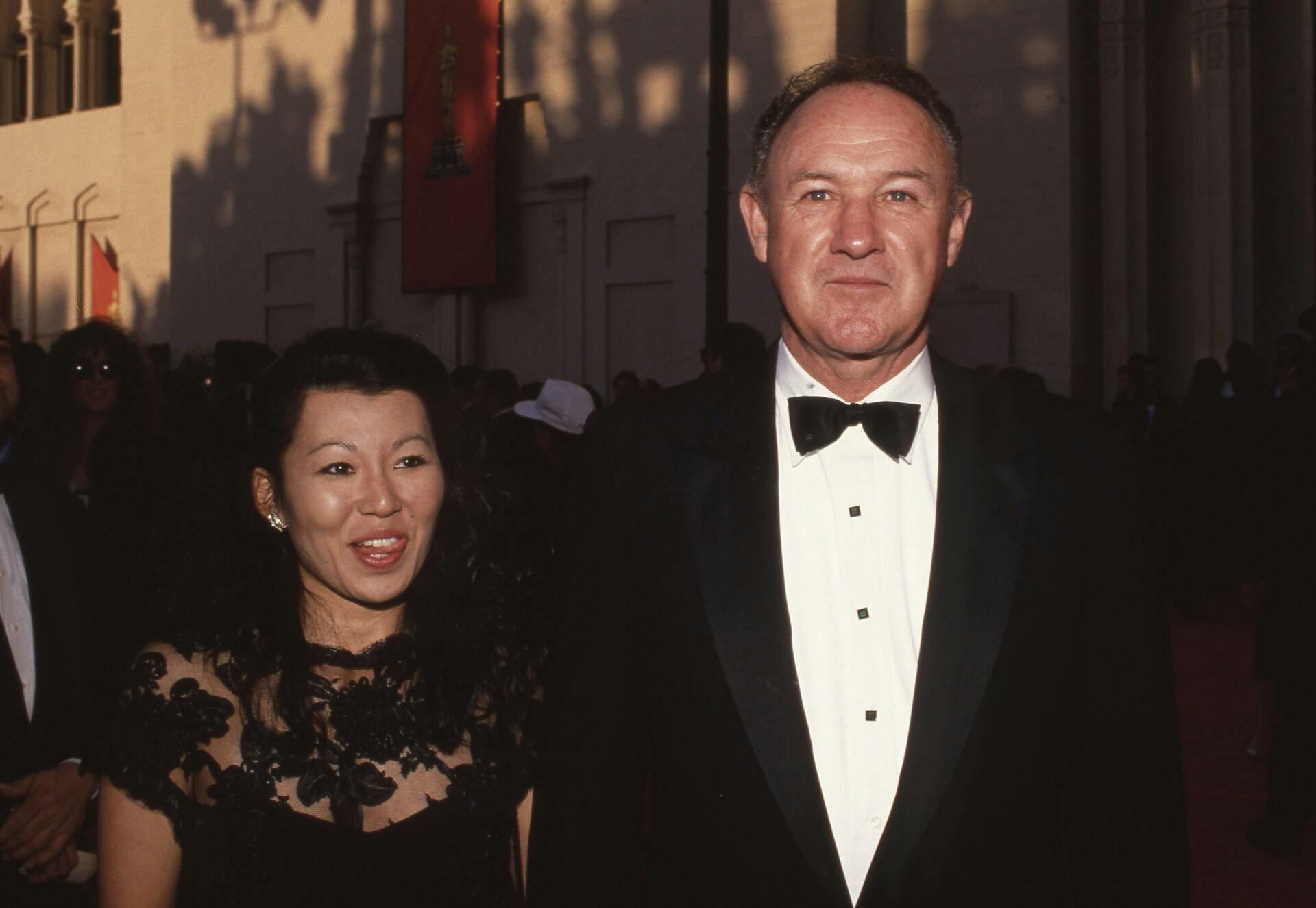 **FILE PHOTO** Gene Hackman and Wife Betsy Found Dead In Santa Fe Home. Gene Hackman and Betsy Arakawa at the 61st Annual Academy Awards at Shrine Auditorium in Los Angeles, California March 29, 1989 Credit: Ralph Dominguez/MediaPunch /IPX