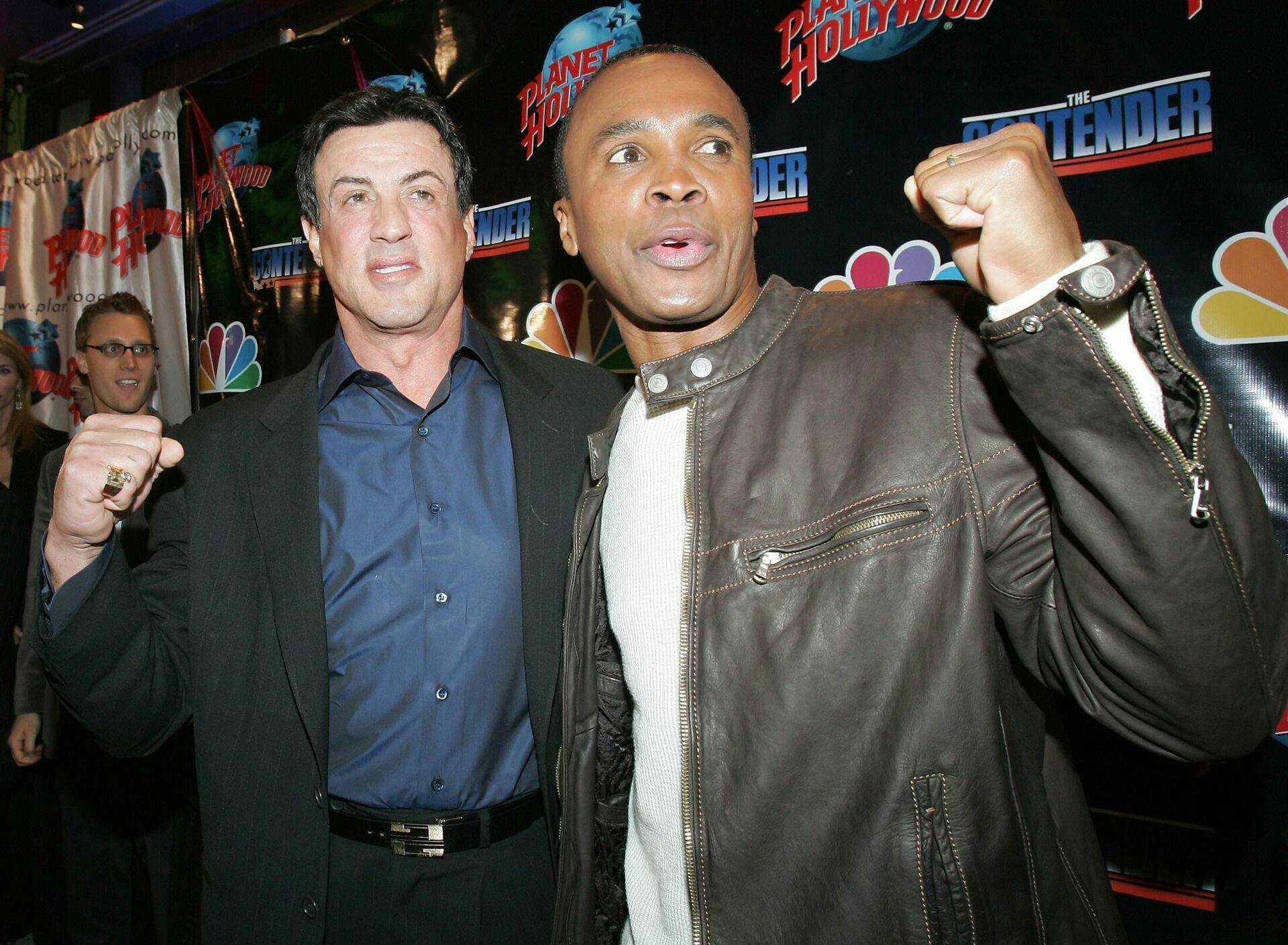 Actor Sylvester Stallone (L) and boxer Sugar Ray Leonard pose during the premiere party of NBC's reality show "The Contender" in New York late March 7, 2005. REUTERS/Albert Ferreira