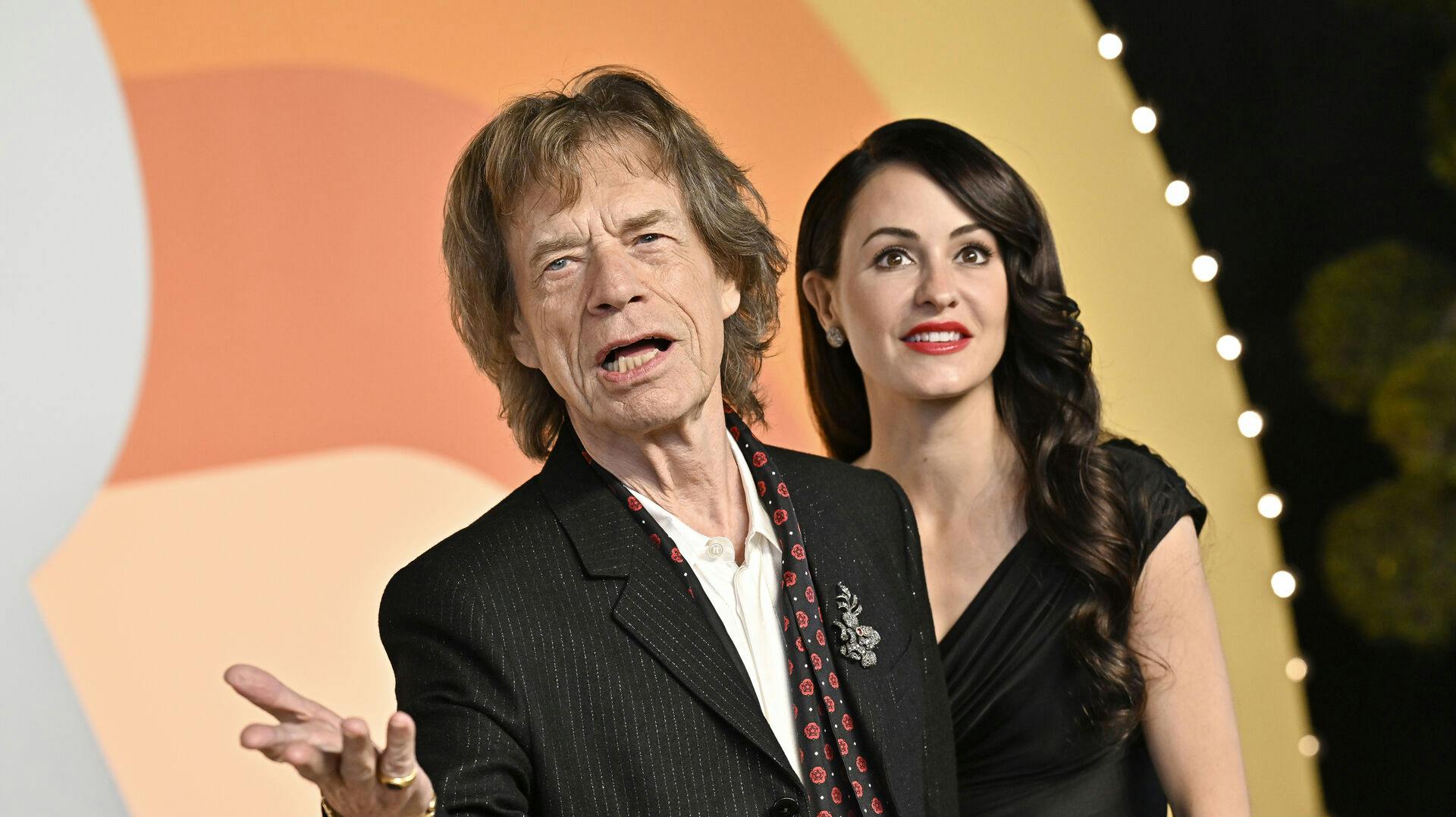 Mick Jagger, left, and Melanie Hamrick arrive at the Vanity Fair Oscar Party on Sunday, March 2, 2025, at the Wallis Annenberg Center for the Performing Arts in Beverly Hills, Calif. (Photo by Evan Agostini/Invision/AP)