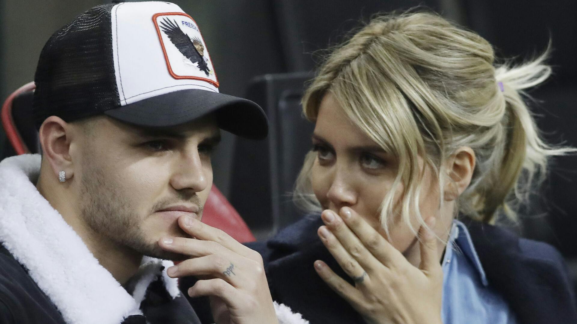 Inter Milan's Mauro Icardi is flanked by his wife Wanda Nara during the Europa League, round of 32, second leg soccer match between Inter Milan and SK Rapid Vienna, at the San Siro stadium in Milan, Italy, Thursday, Feb. 21, 2019. (AP Photo/Luca Bruno)