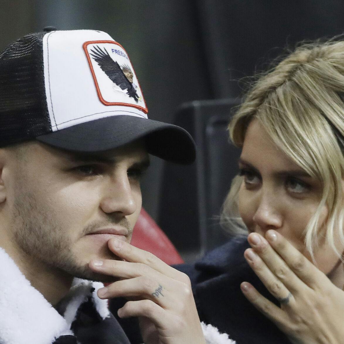 Inter Milan's Mauro Icardi is flanked by his wife Wanda Nara during the Europa League, round of 32, second leg soccer match between Inter Milan and SK Rapid Vienna, at the San Siro stadium in Milan, Italy, Thursday, Feb. 21, 2019. (AP Photo/Luca Bruno)