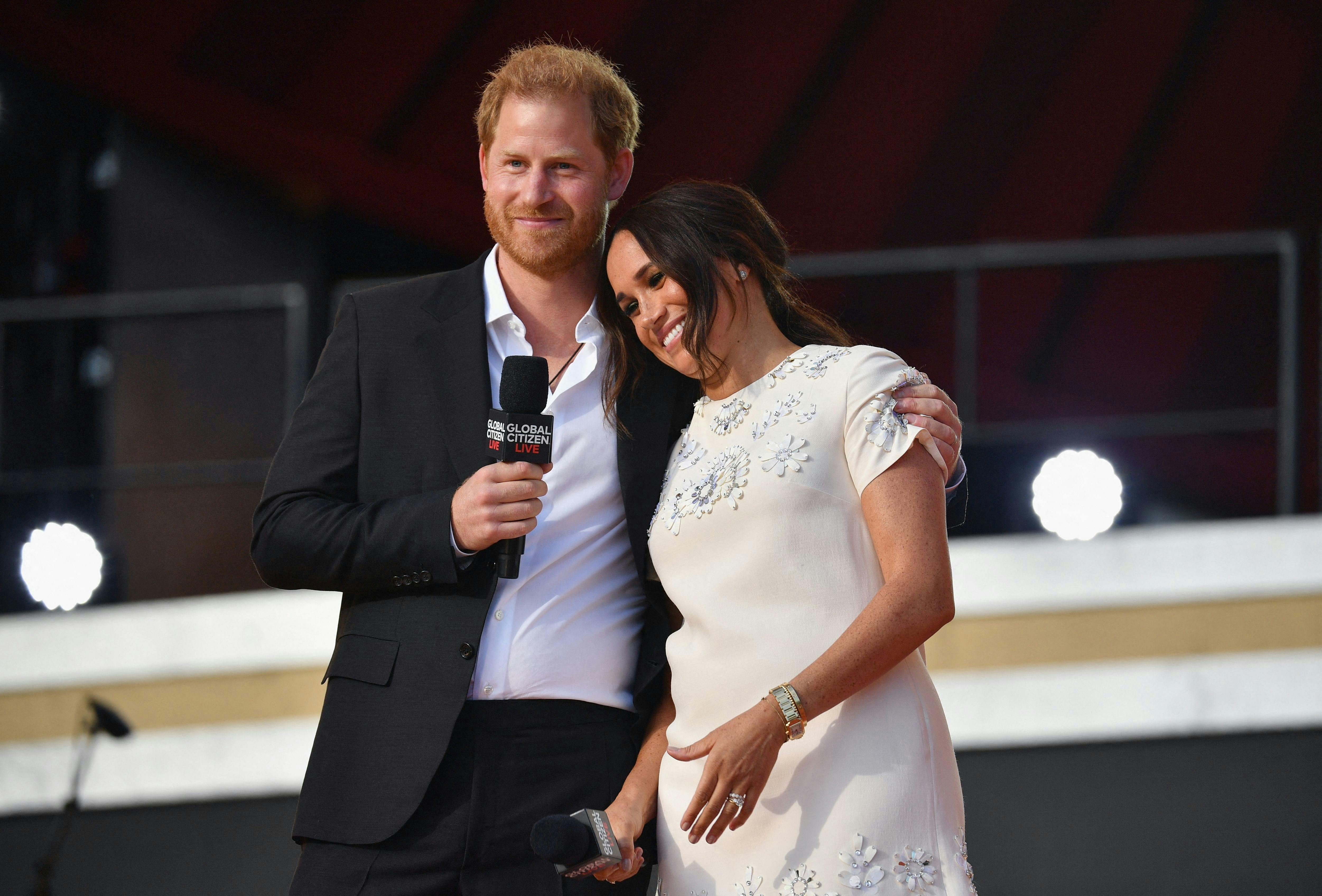 (FILES) Britain's Prince Harry and Meghan Markle speak during the 2021 Global Citizen Live festival at the Great Lawn, Central Park on September 25, 2021 in New York City. A multi-million-dollar deal between a media group run by Britain's Prince Harry and his wife Meghan Markle, and streaming giant Spotify is to end, a report said June 15, 2023. (Photo by Angela Weiss / AFP)