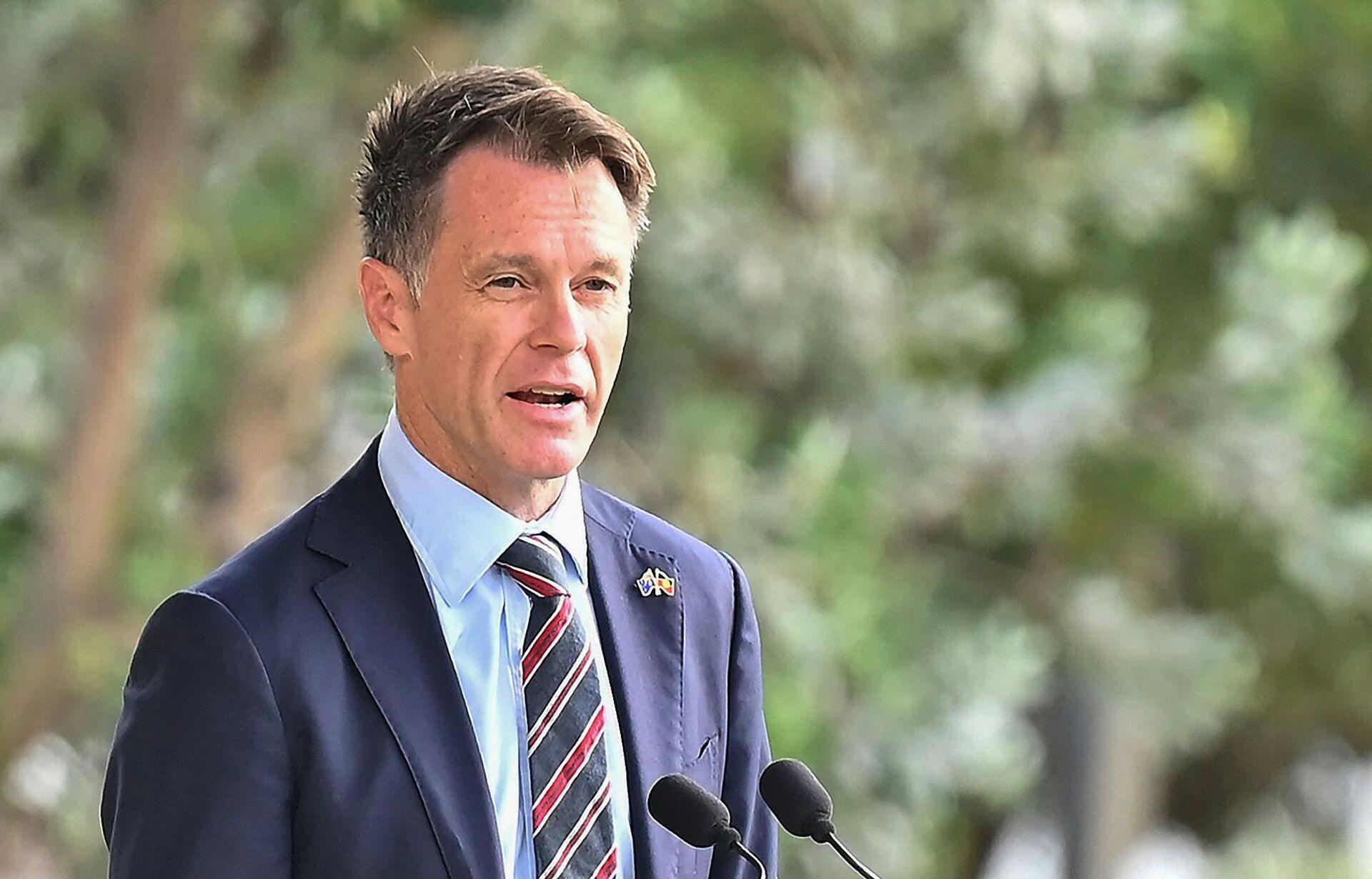 New South Wales Premier Chris Minns gives a speech during the Australia Day WugulOra Morning Ceremony at Barangaroo Reserve near the Sydney Harbour Bridge in Sydney on January 26, 2025. (Photo by AYUSH KUMAR / AFP)