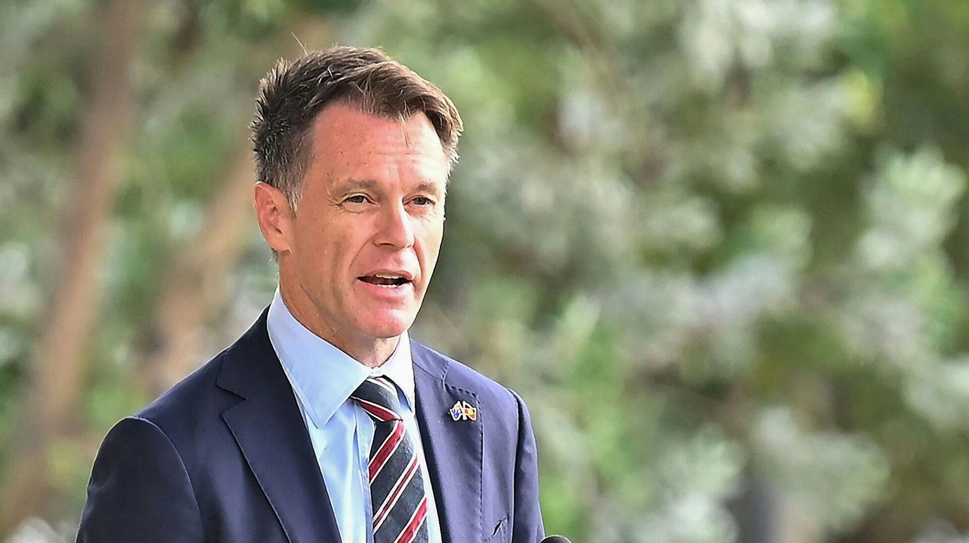 New South Wales Premier Chris Minns gives a speech during the Australia Day WugulOra Morning Ceremony at Barangaroo Reserve near the Sydney Harbour Bridge in Sydney on January 26, 2025. (Photo by AYUSH KUMAR / AFP)