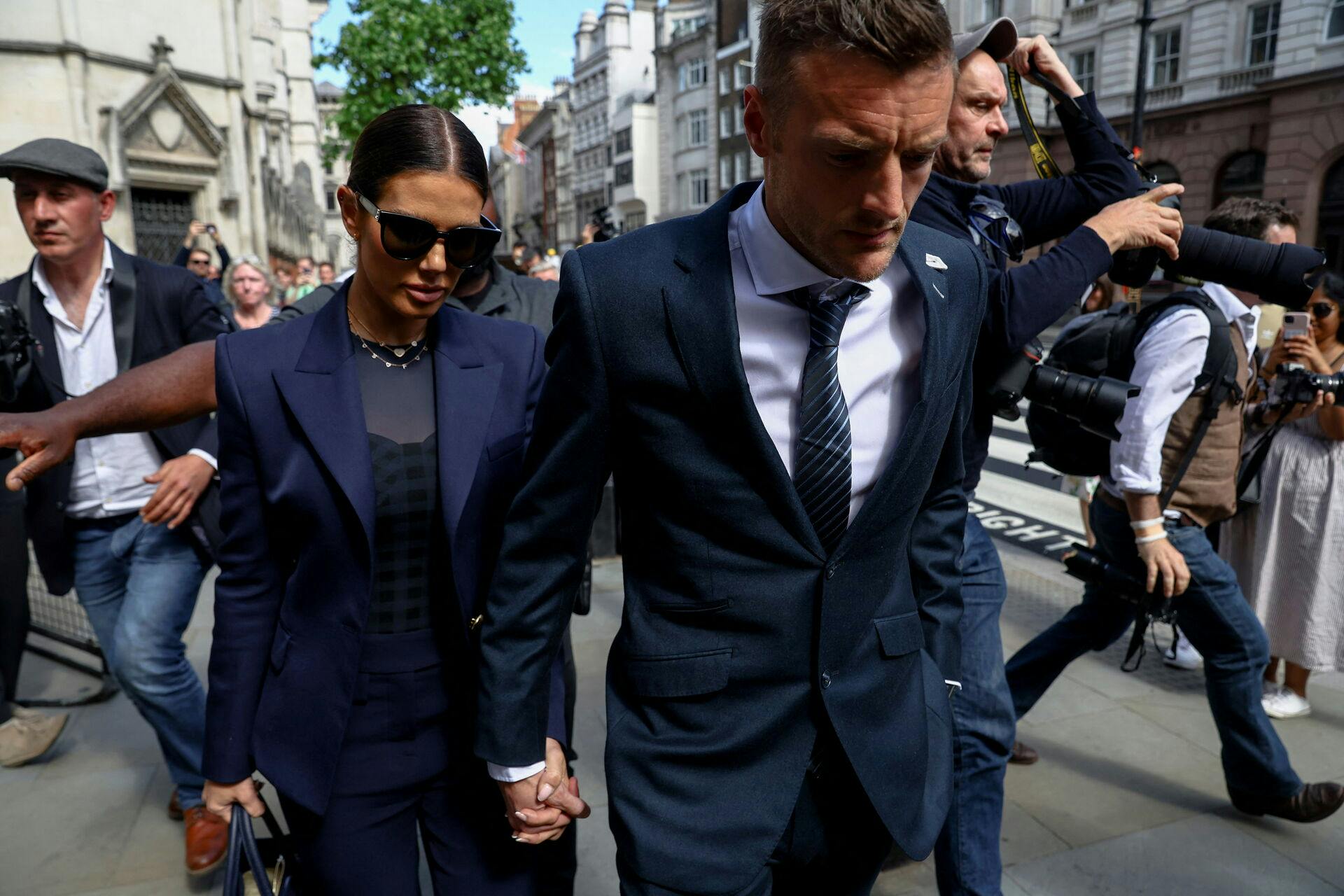 Rebekah Vardy and her husband, Leicester City soccer player Jamie Vardy, leave the Royal Courts of Justice, in London, Britain, May 17, 2022. REUTERS/Hannah McKay
