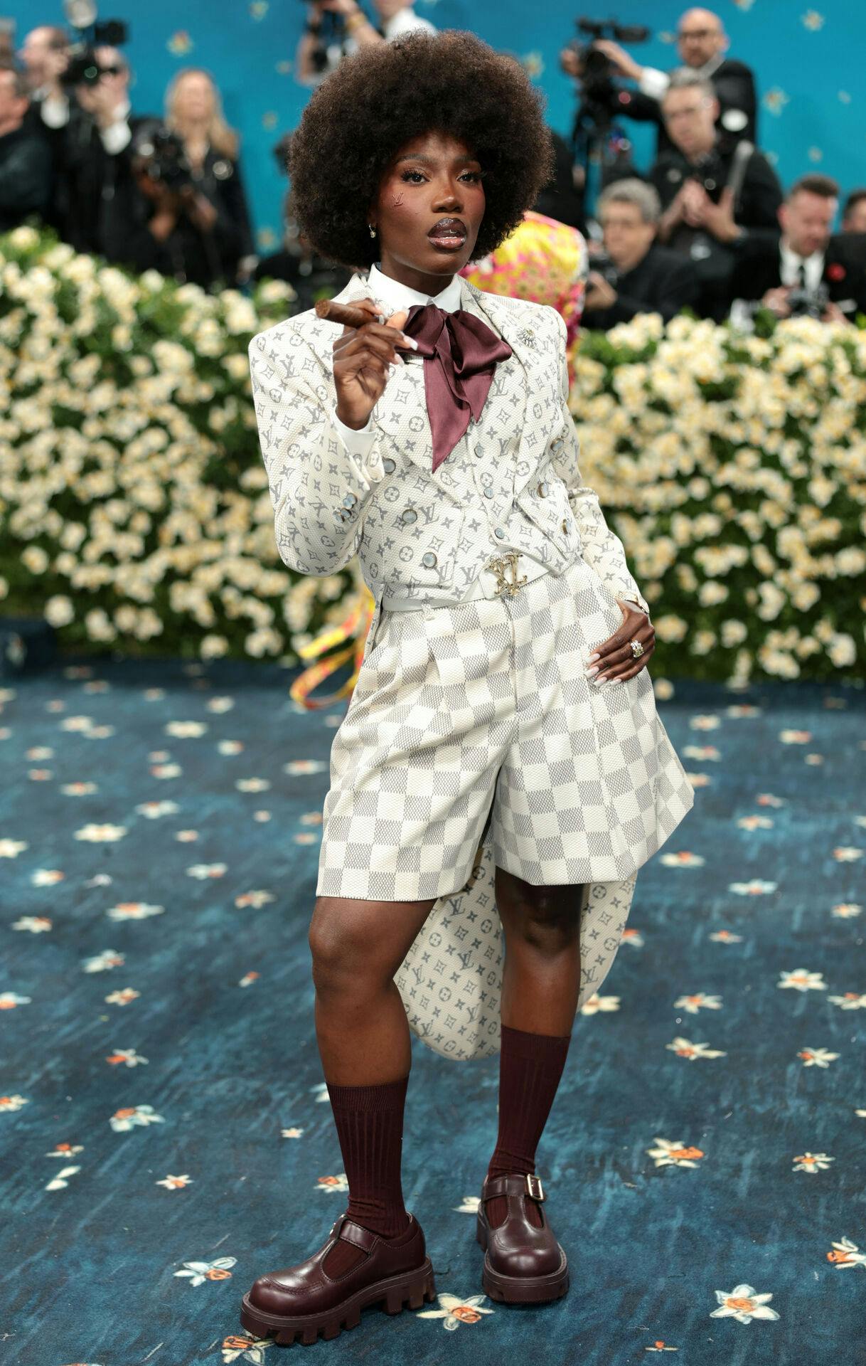 Doechii poses during the Met Gala, an annual fundraising gala held for the benefit of the Metropolitan Museum of Art's Costume Institute with this year's theme 'Superfine: Tailoring Black Style, ' in New York City, New York, U.S., May 5, 2025. REUTERS/Mario Anzuoni
