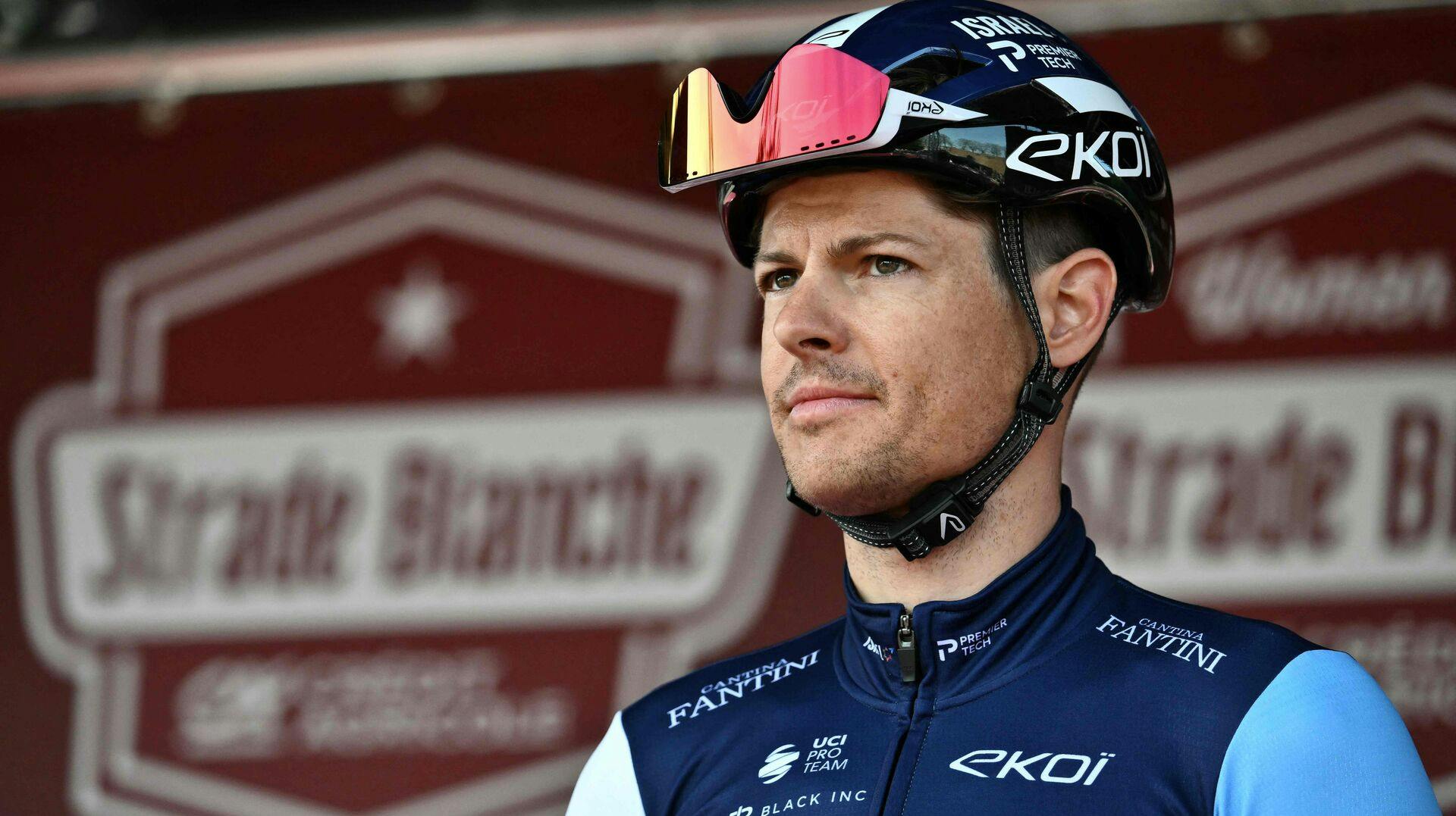 Team Israel Premier Tech's Danish rider Jakob Fuglsang looks on before the 19th one-day classic 'Strade Bianche' (White Roads) cycling race between Siena and Siena, Tuscany, on March 8, 2025. (Photo by Marco BERTORELLO / AFP)