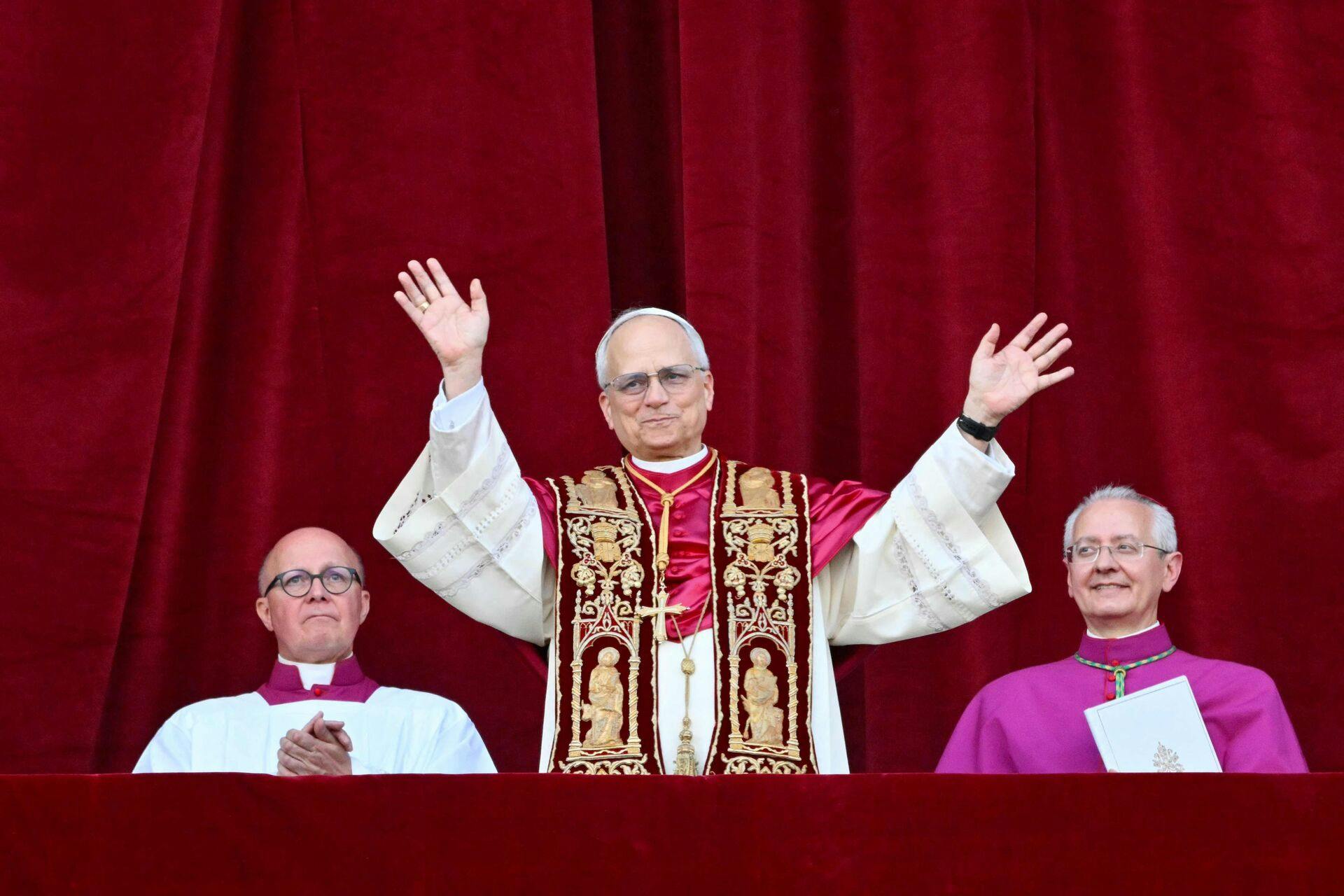 Newly elected Pope Leo XIV, Robert Prevost from the main central loggia balcony of the St Peter's Basilica for the first time, after the cardinals ended the conclave, in The Vatican, on May 8, 2025. Robert Francis Prevost was on Thursday elected the first pope from the United States, the Vatican announced. A moderate who was close to Pope Francis and spent years as a missionary in Peru, he becomes the Catholic Church's 267th pontiff, taking the papal name Leo XIV. (Photo by Alberto PIZZOLI / AFP)