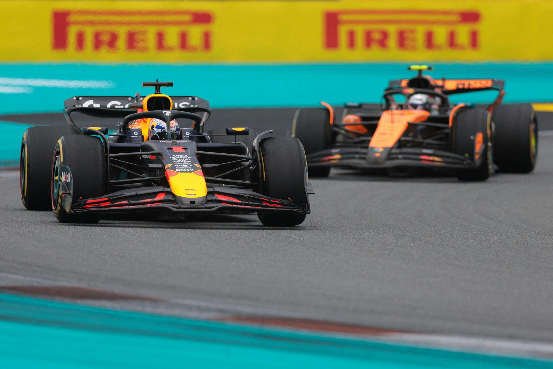 May 4, 2025; Miami Gardens, FL, USA; Red Bull driver Max Verstappen (1) races ahead of McLaren driver Lando Norris (4) during the F1 Miami Grand Prix at Miami International Autodrome. Mandatory Credit: Sam Navarro-Imagn Images