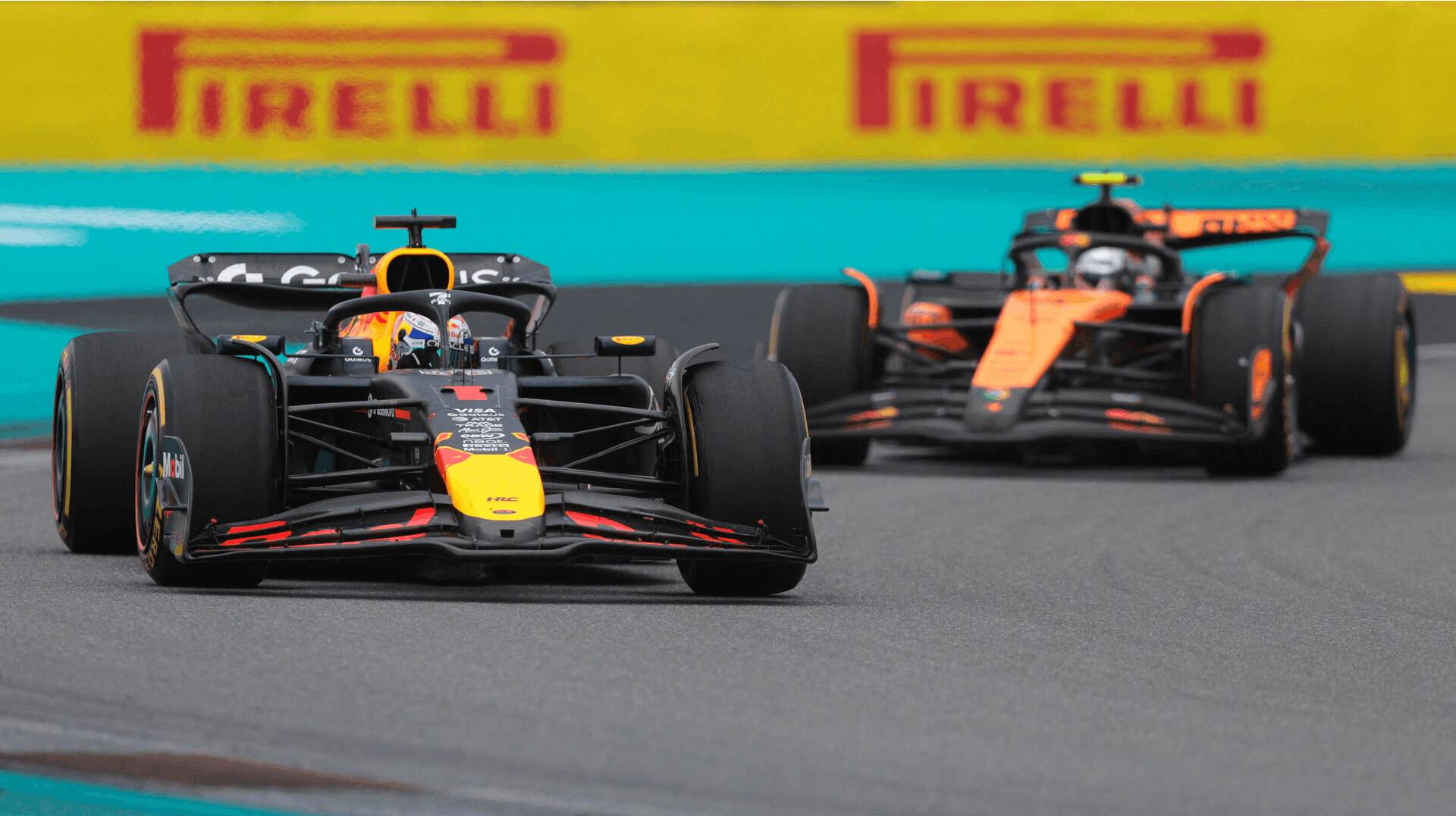May 4, 2025; Miami Gardens, FL, USA; Red Bull driver Max Verstappen (1) races ahead of McLaren driver Lando Norris (4) during the F1 Miami Grand Prix at Miami International Autodrome. Mandatory Credit: Sam Navarro-Imagn Images