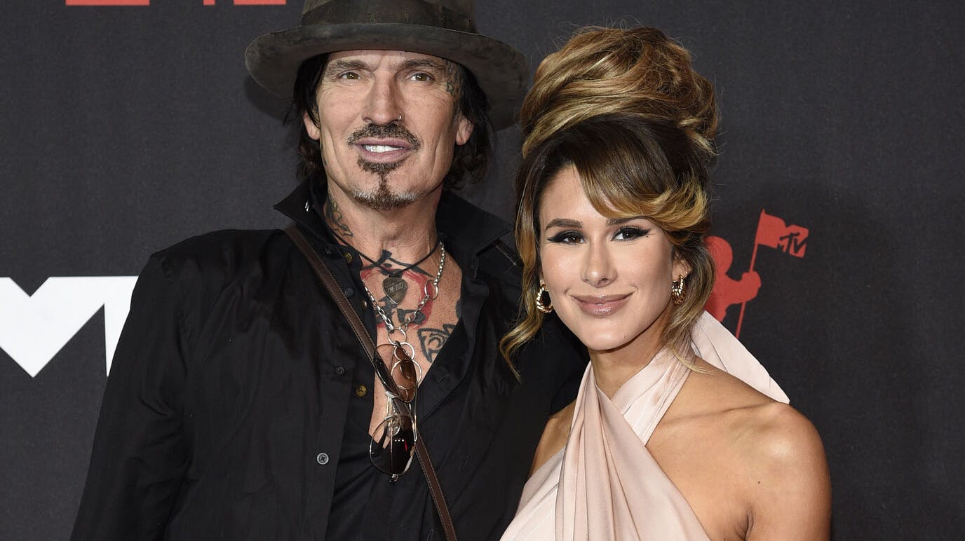 Tommy Lee, left, and Brittany Furlan arrive at the MTV Video Music Awards at Barclays Center on Sunday, Sept. 12, 2021, in New York. (Photo by Evan Agostini/Invision/AP)