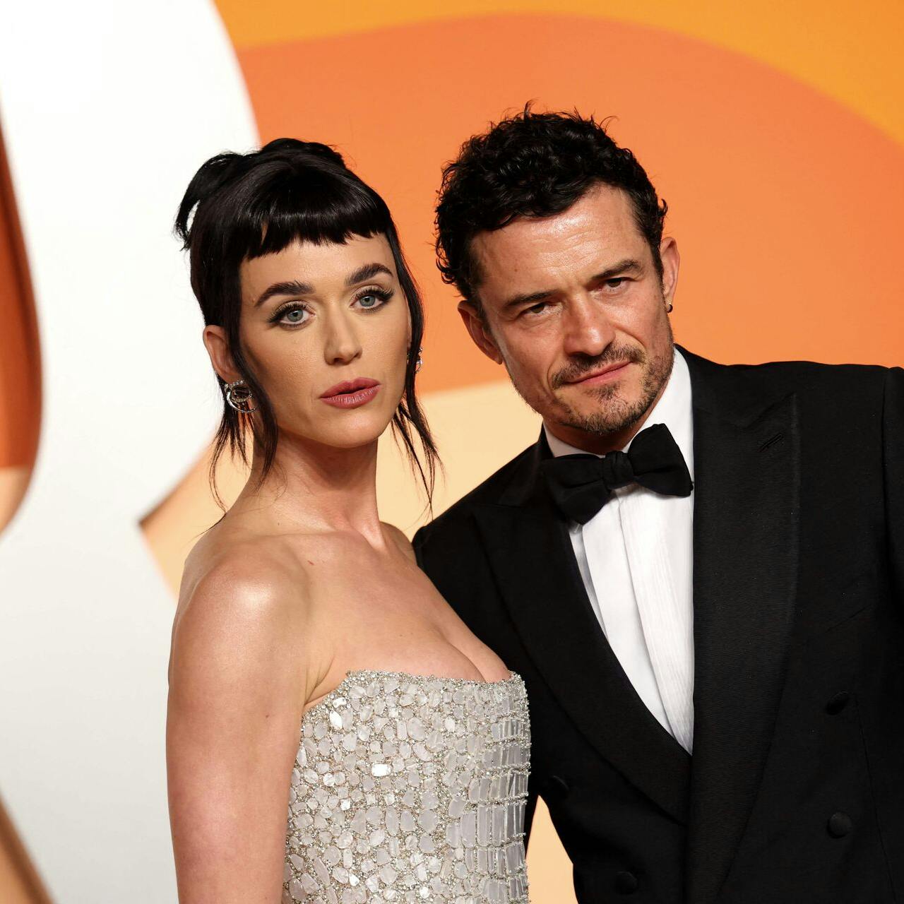 US singer Katy Perry (L) and English actor Orlando Bloom attend the Vanity Fair Oscar Party at the Wallis Annenberg Center for the Performing Arts in Beverly Hills, California, on March 2, 2025. (Photo by Michael Tran / AFP)