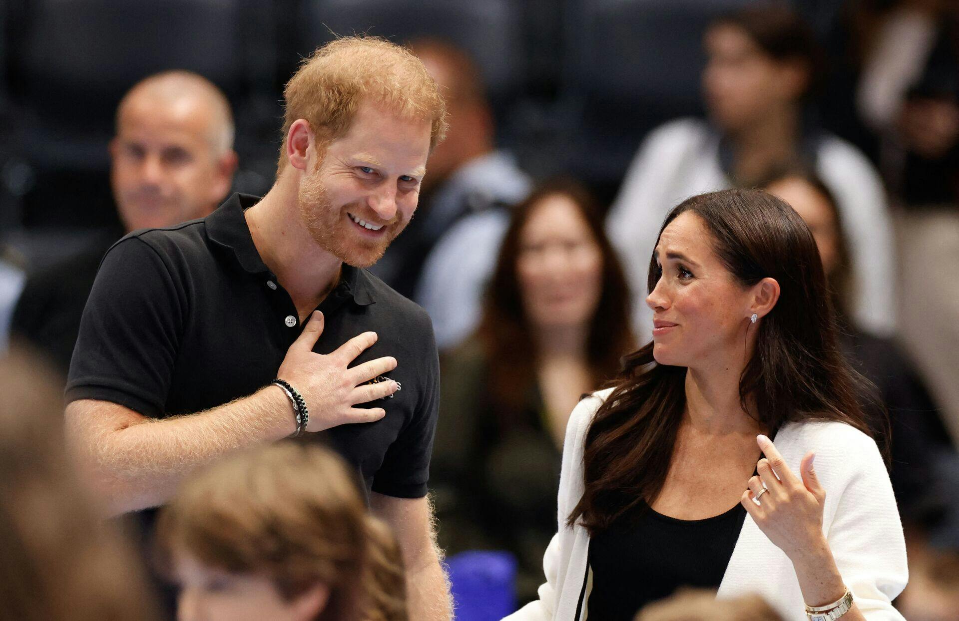 (FILES) Britain's Meghan, Duchess of Sussex and Britain's Prince Harry, Duke of Sussex, attend a children's event at the 2023 Invictus Games in Duesseldorf, western Germany on September 13, 2023. Prince Harry Friday, may 2, lost his court bid to restore his UK police protection after the UK government downgraded his security when he stepped back from royal life and moved abroad. (Photo by Odd ANDERSEN / AFP)
