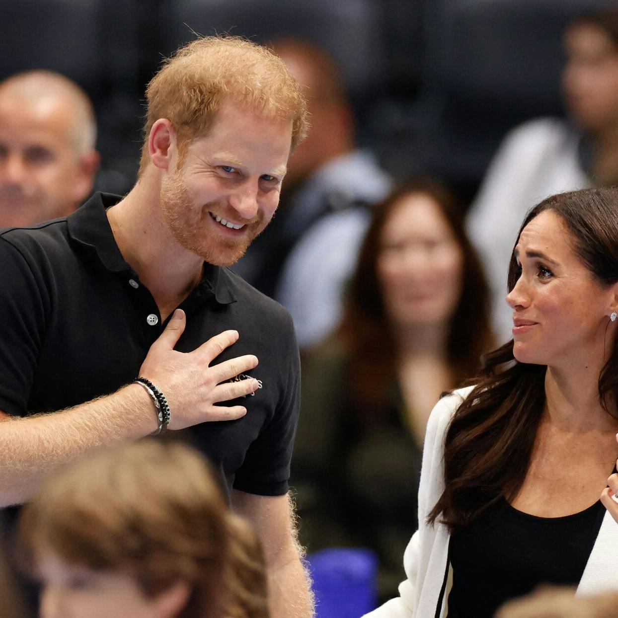 (FILES) Britain's Meghan, Duchess of Sussex and Britain's Prince Harry, Duke of Sussex, attend a children's event at the 2023 Invictus Games in Duesseldorf, western Germany on September 13, 2023. Prince Harry Friday, may 2, lost his court bid to restore his UK police protection after the UK government downgraded his security when he stepped back from royal life and moved abroad. (Photo by Odd ANDERSEN / AFP)