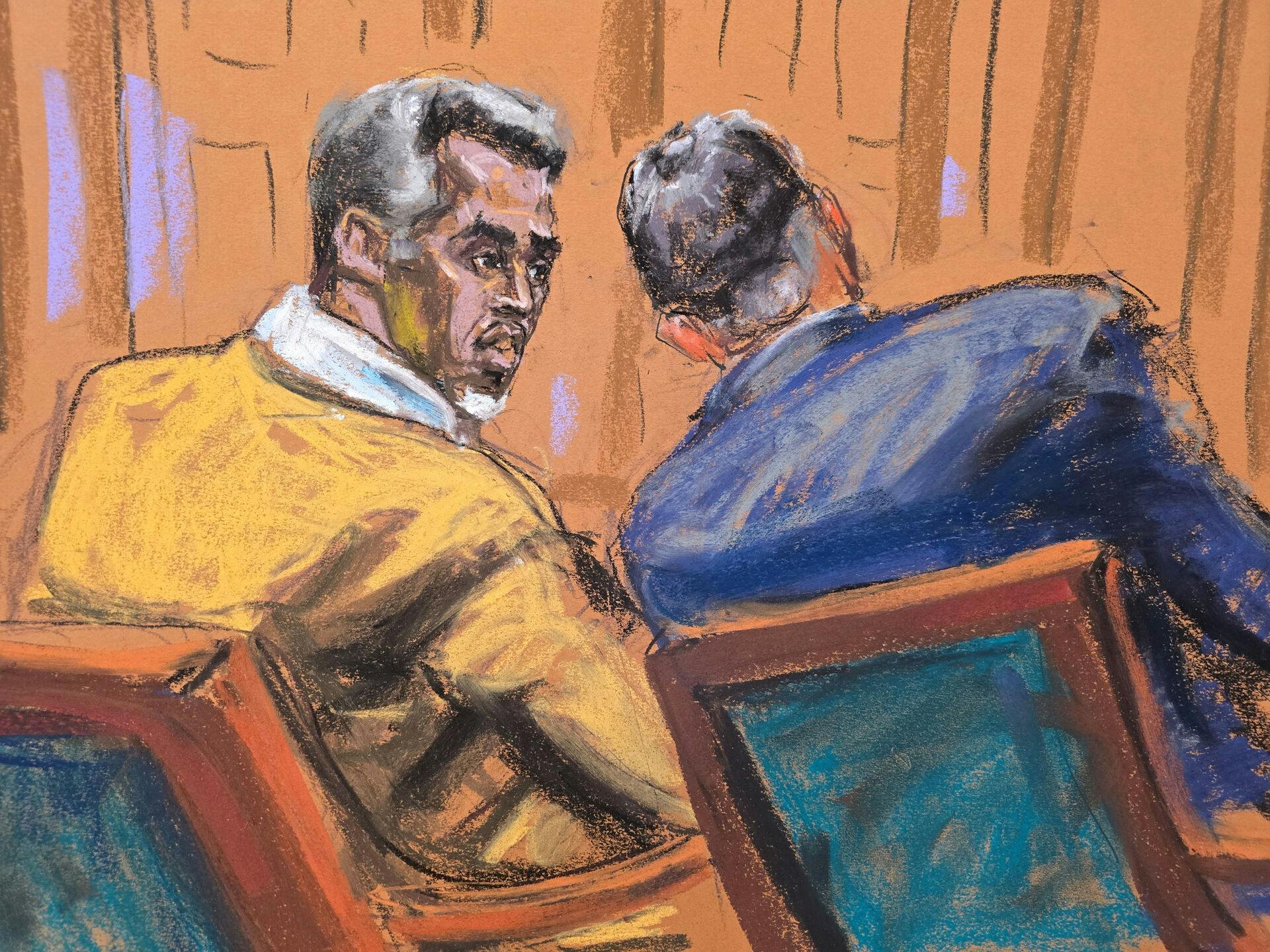 Sean "Diddy" Combs taler med sin advokat Marc Agnifilo under retssagen, der mandag fortsatte på sjette dag.