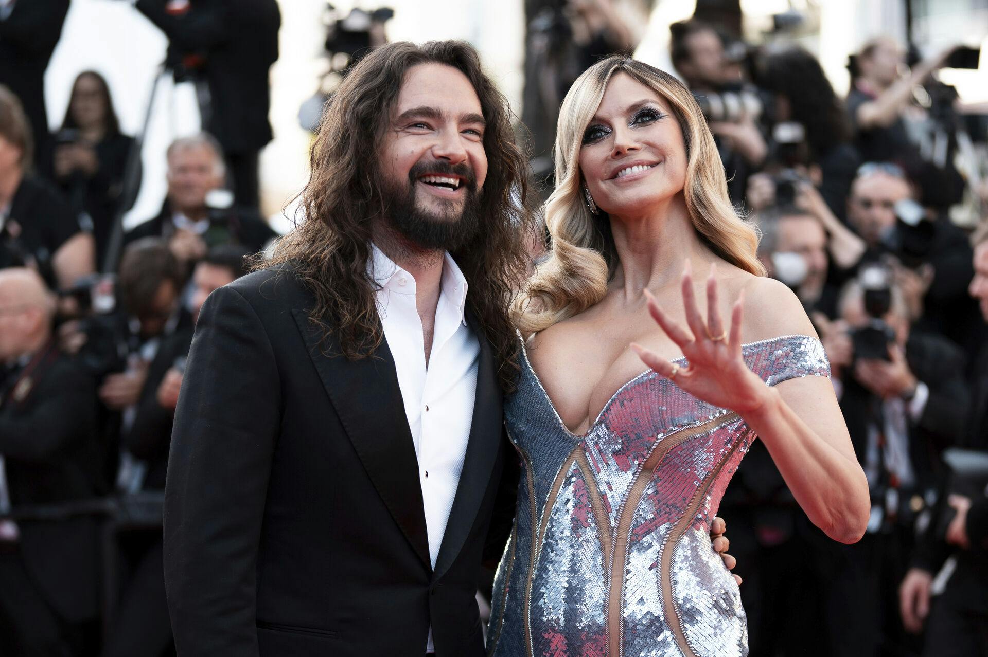 Tom Kaulitz, left, and Heidi Klum pose for photographers