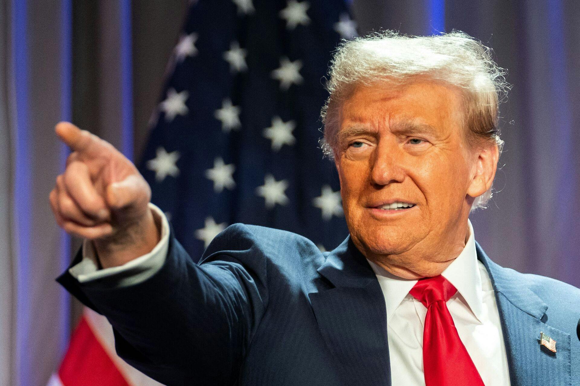 TOPSHOT - US President-elect Donald Trump gestures while speaking during a meeting with House Republicans at the Hyatt Regency hotel in Washington, DC on November 13, 2024. (Photo by Allison ROBBERT / POOL / AFP)