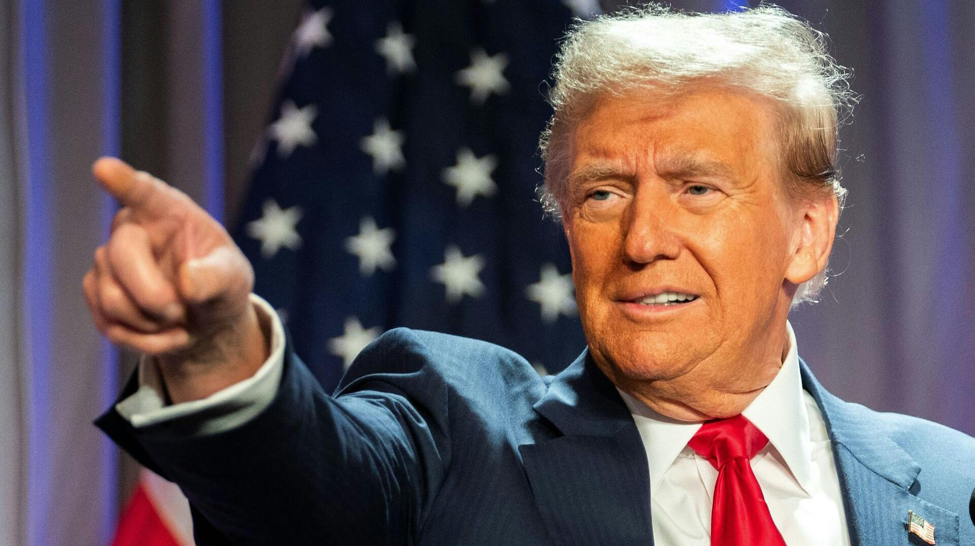 TOPSHOT - US President-elect Donald Trump gestures while speaking during a meeting with House Republicans at the Hyatt Regency hotel in Washington, DC on November 13, 2024. (Photo by Allison ROBBERT / POOL / AFP)