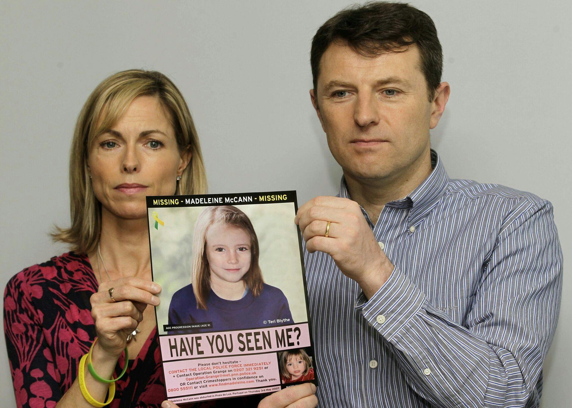 Kate og Gerry McCann med et efterlysningsbillede af deres datter. De har selv været mistænkt i forbindelse med efterforskningen af sagen.