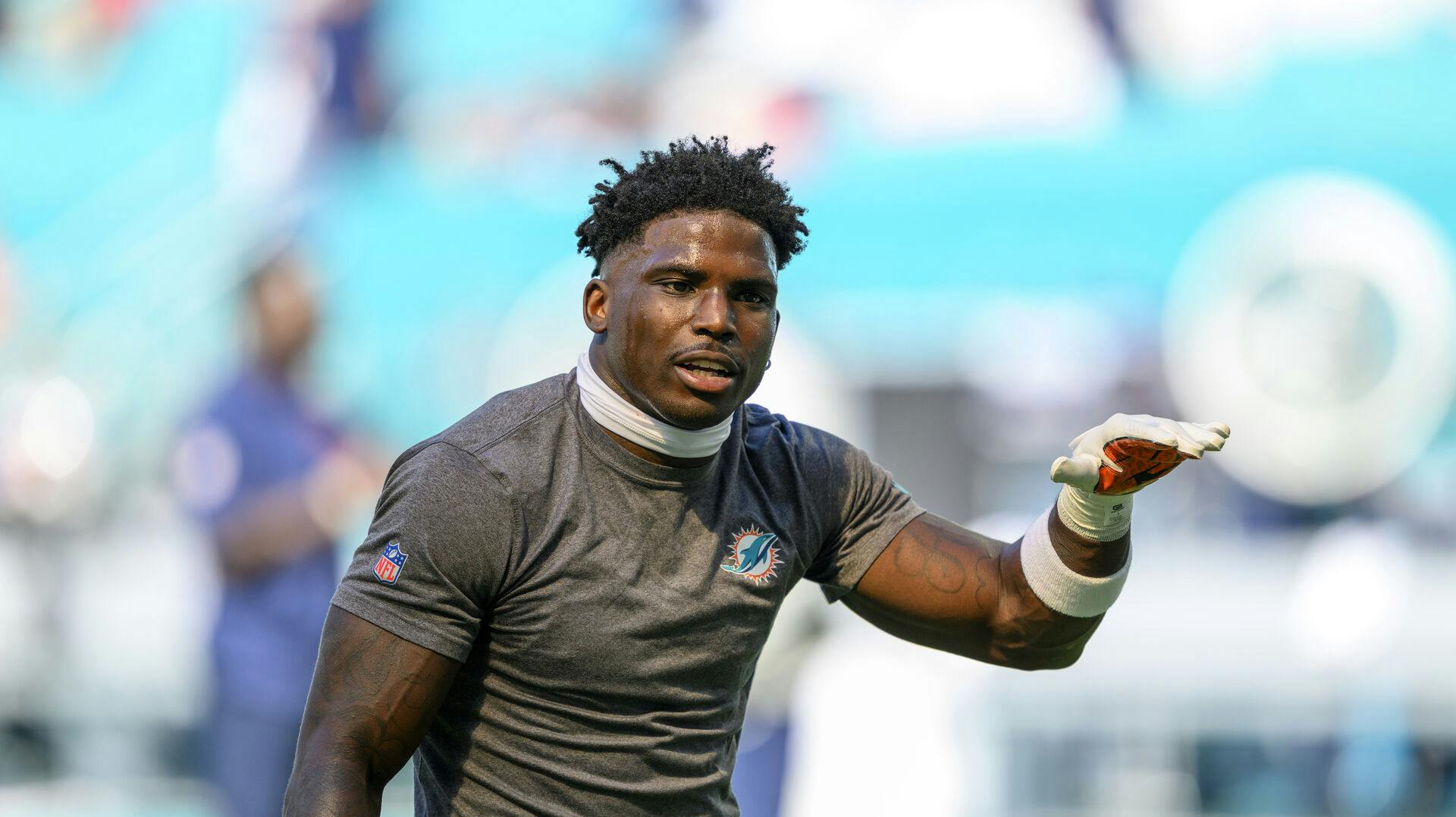 Miami Dolphins wide receiver Tyreek Hill (10) gestures on the field as he practices before an NFL football game against the New England Patriots, Sunday, Nov. 24 2024, in Miami Gardens, Fla. (AP Photo/Doug Murray)