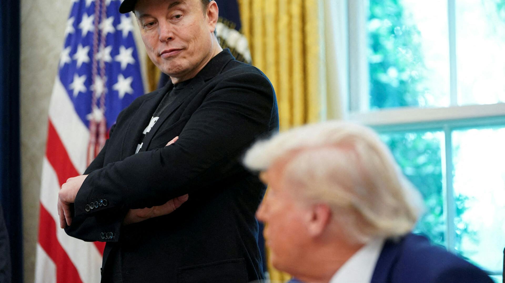 FILE PHOTO: U.S. President Donald Trump and Elon Musk attend a press conference in the Oval Office of the White House in Washington, D.C., U.S., May 30, 2025. REUTERS/Nathan Howard/File Photo