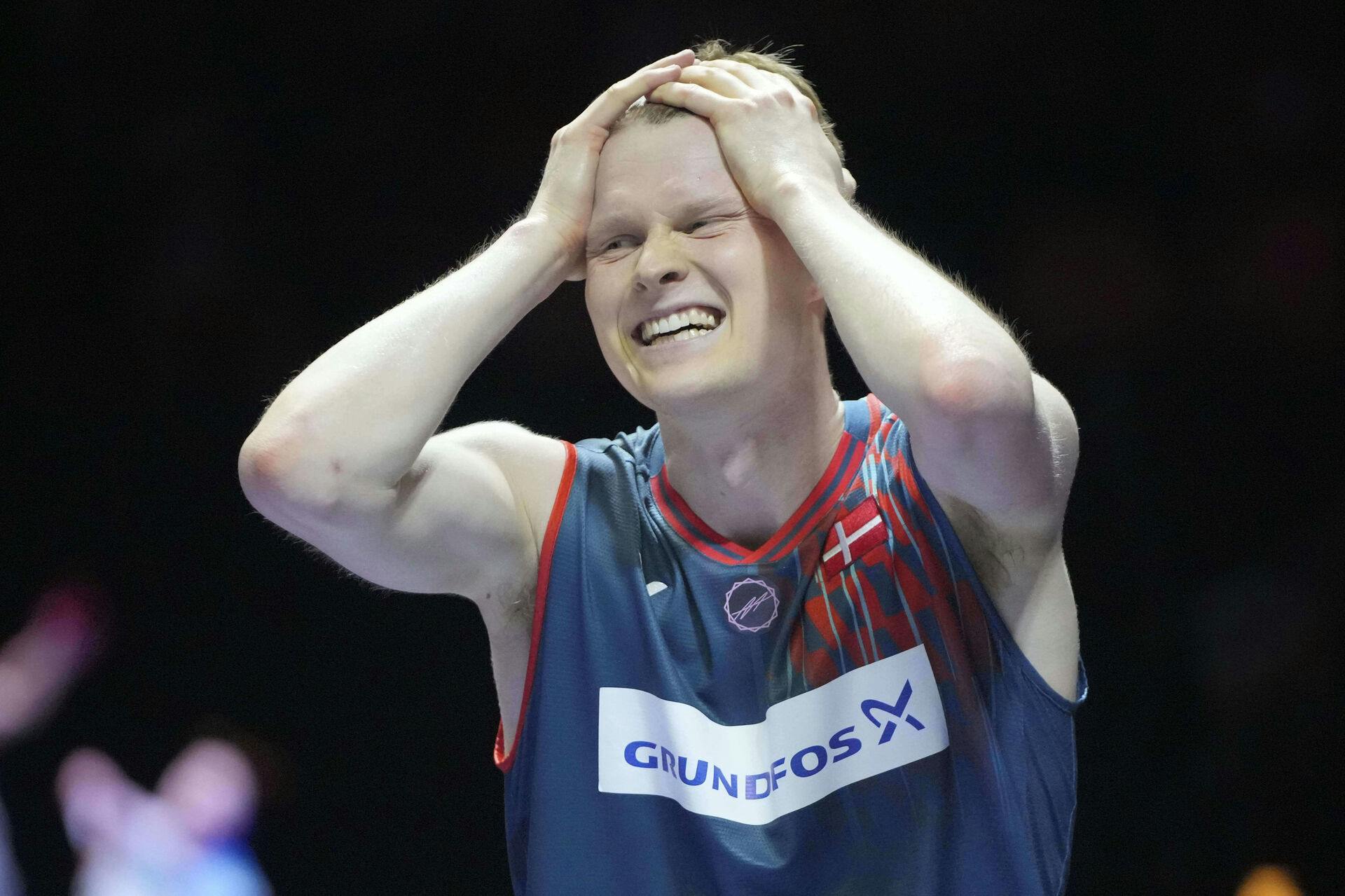 Denmark's Anders Antonsen celebrates after wining his men's singles semifinal match against China's Shi Yuqi during the Indonesia Open badminton tournament at the Istora Stadium in Jakarta, Indonesia, Saturday, June 7, 2025. (AP Photo/Achmad Ibrahim)