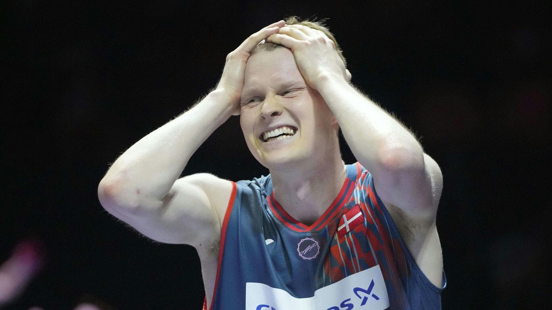 Denmark's Anders Antonsen celebrates after wining his men's singles semifinal match against China's Shi Yuqi during the Indonesia Open badminton tournament at the Istora Stadium in Jakarta, Indonesia, Saturday, June 7, 2025. (AP Photo/Achmad Ibrahim)