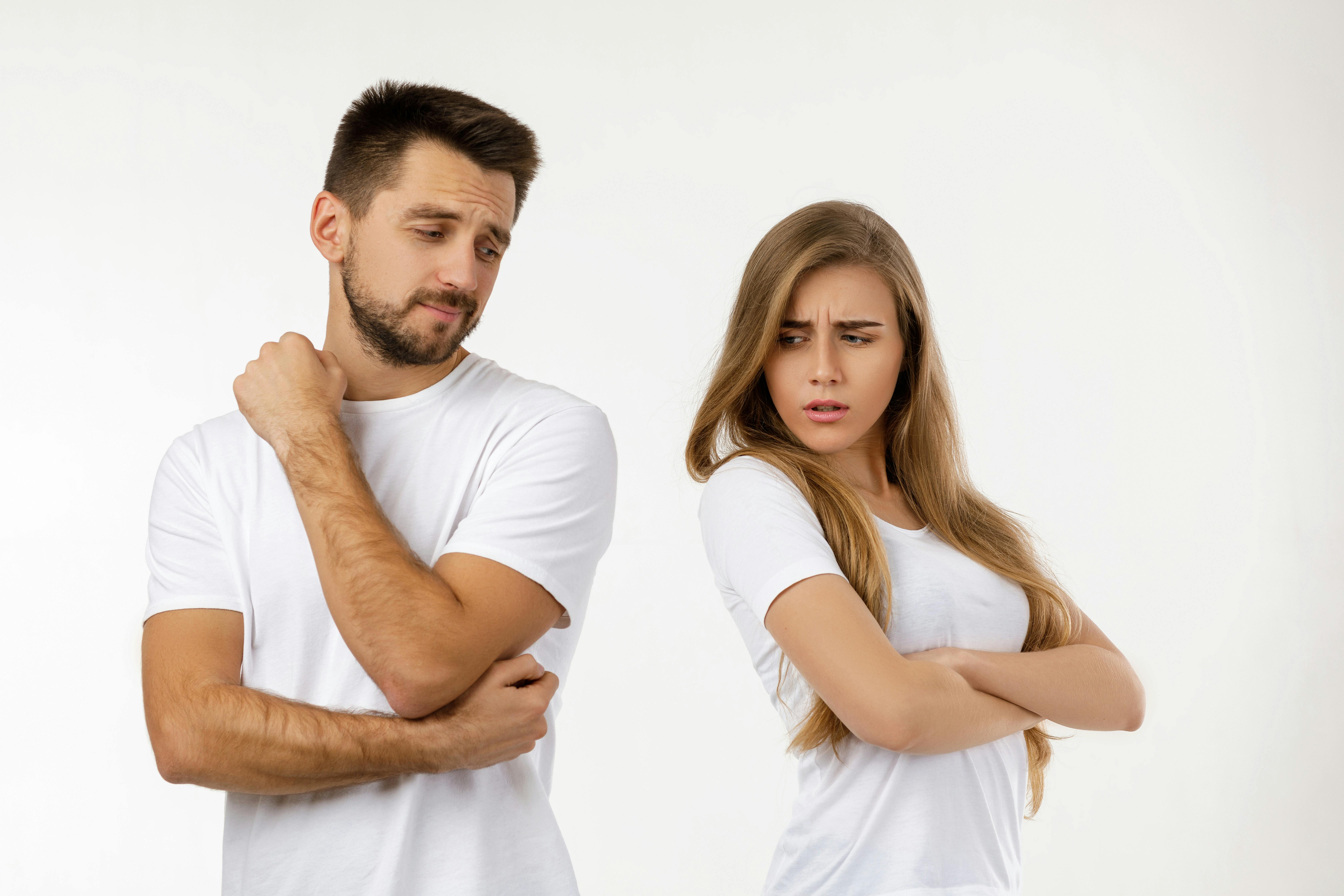 couple argued and resent each other. young woman and her boyfriend standing on white background