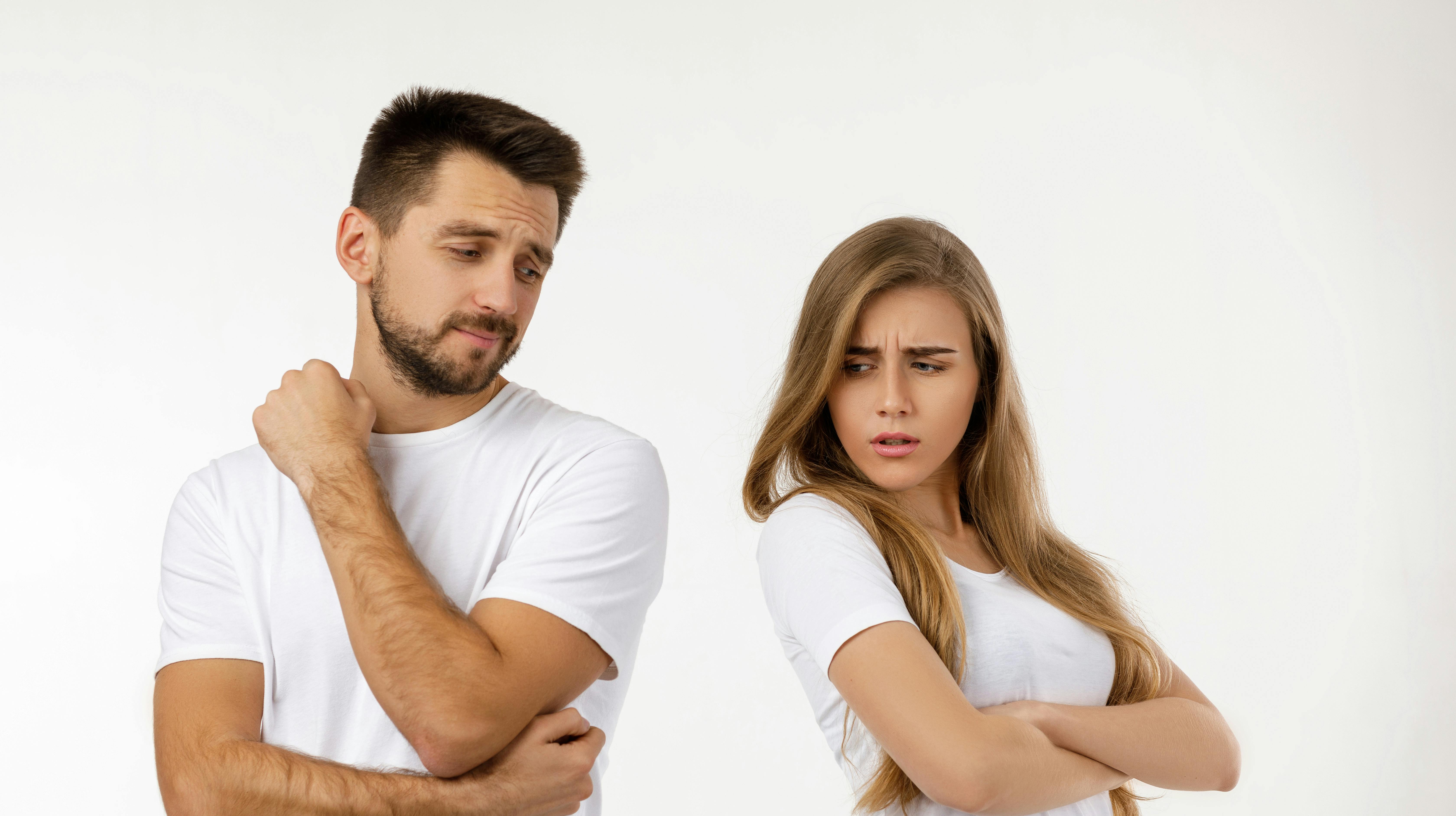 couple argued and resent each other. young woman and her boyfriend standing on white background