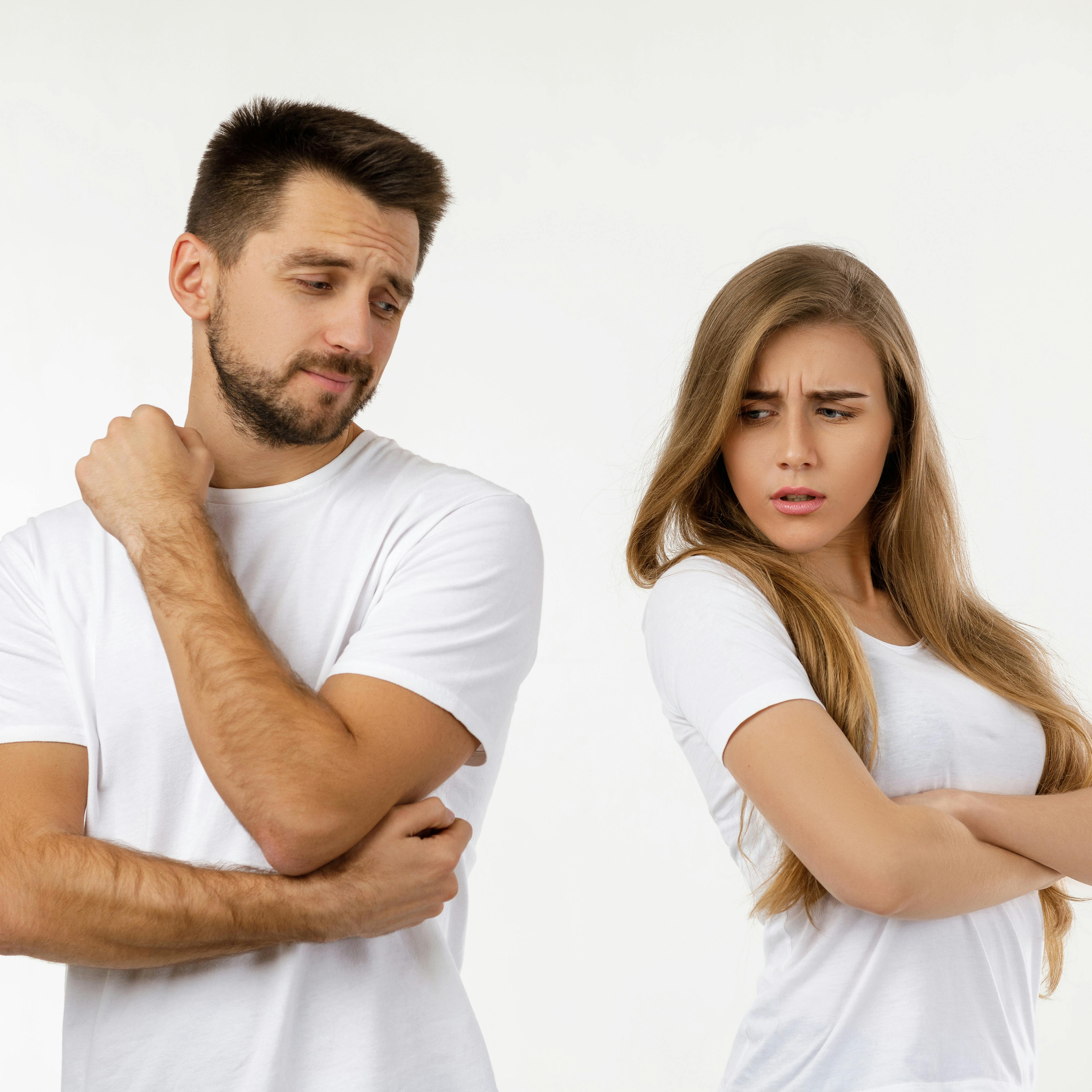 couple argued and resent each other. young woman and her boyfriend standing on white background