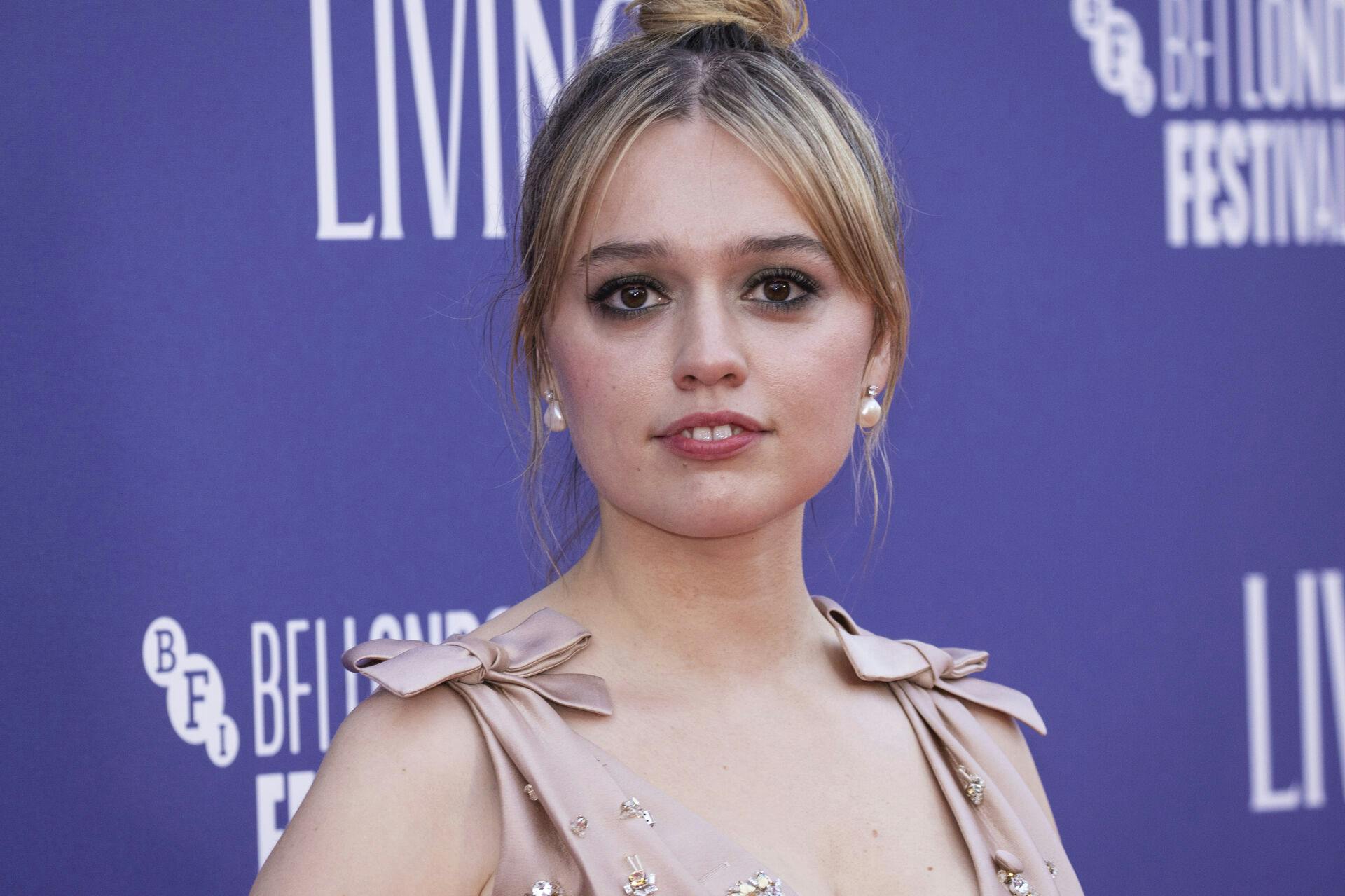 Aimee Lou Wood poses for photographers upon arrival for the premiere of the film 'Living' during the 2022 London Film Festival in London, Sunday, Oct. 9, 2022. (Photo by Vianney Le Caer/Invision/AP)